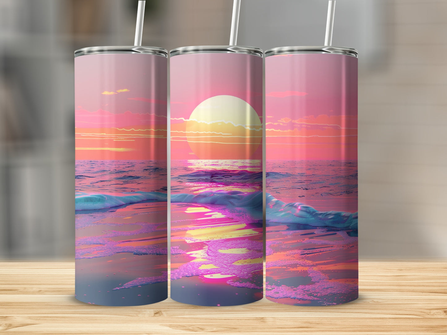 Three tumblers display a vibrant sunset over a sparkling ocean.