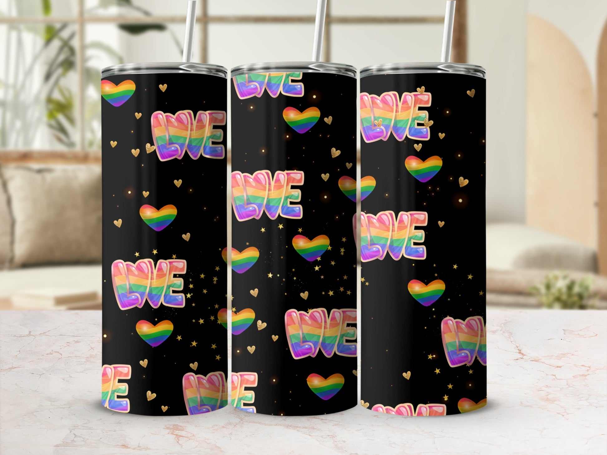 Black tumbler with rainbow "LOVE" text and gold hearts.