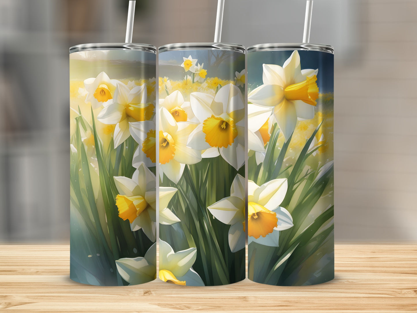 Three tumblers with blooming daffodils and green stems.