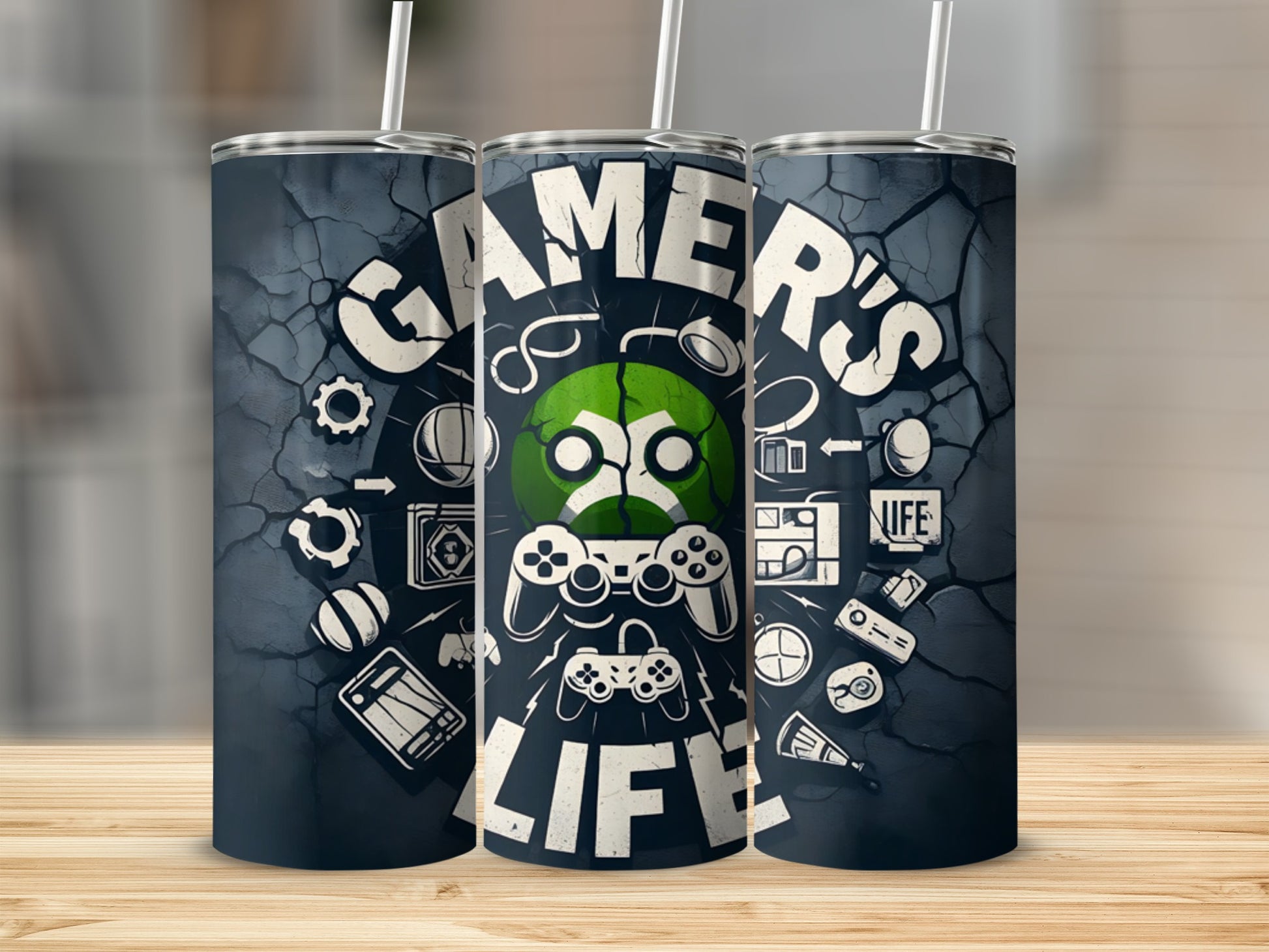 Tumbler with "Gamer's Life" text and gaming icons on a dark textured background.