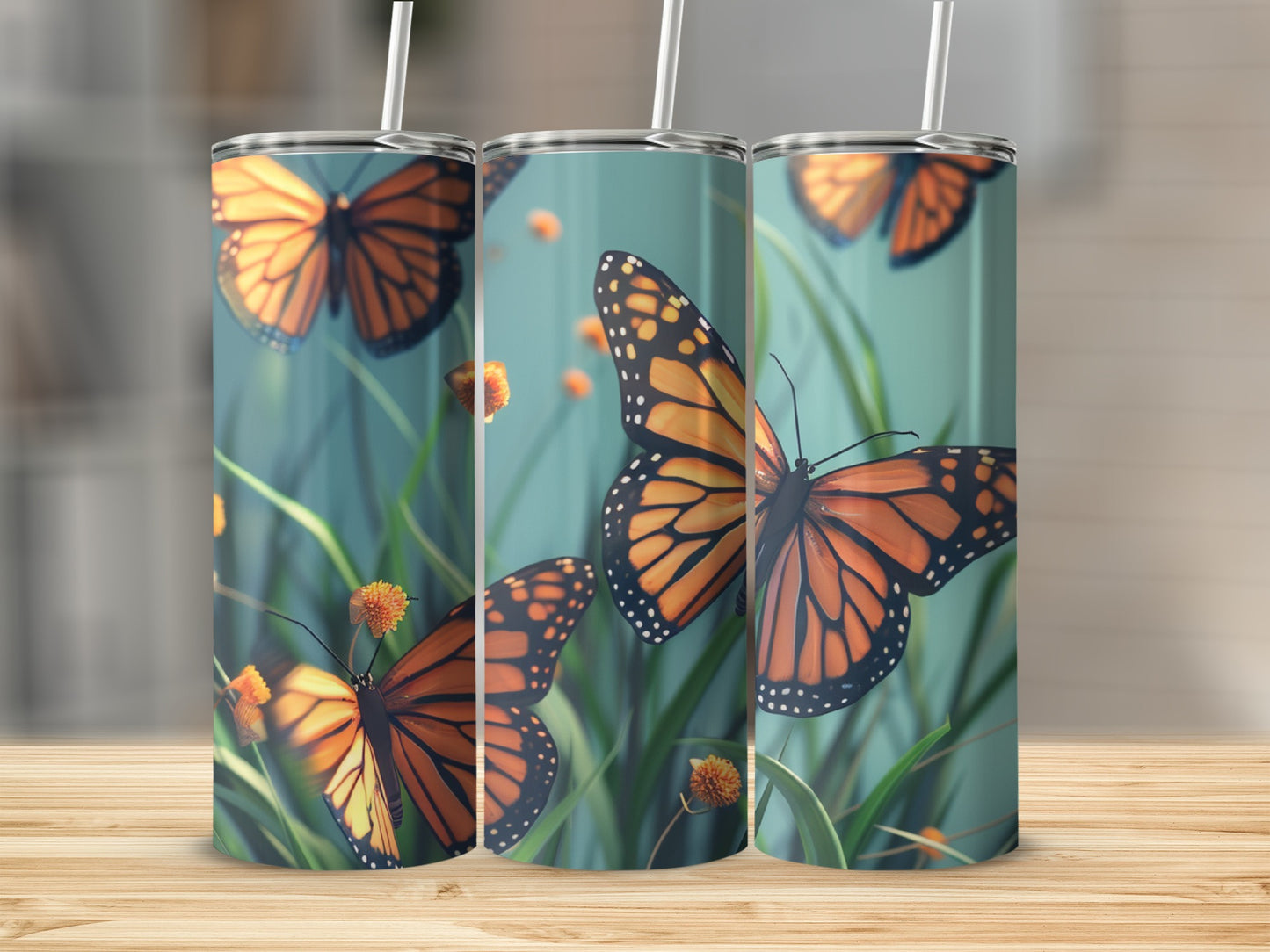 Three monarch butterflies on a tumbler with green grass and yellow flowers.