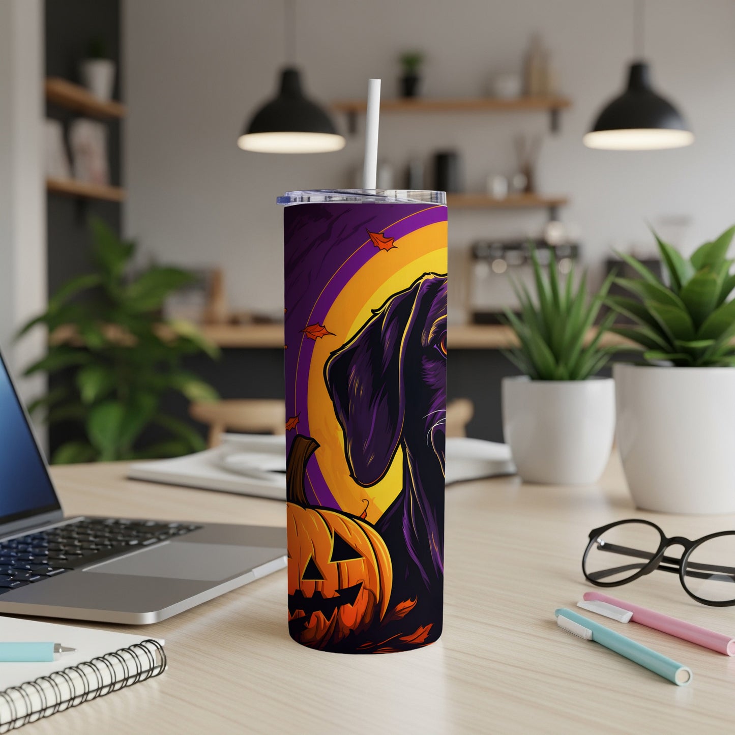 Black dog and pumpkin Halloween design on a purple and orange tumbler with a straw.