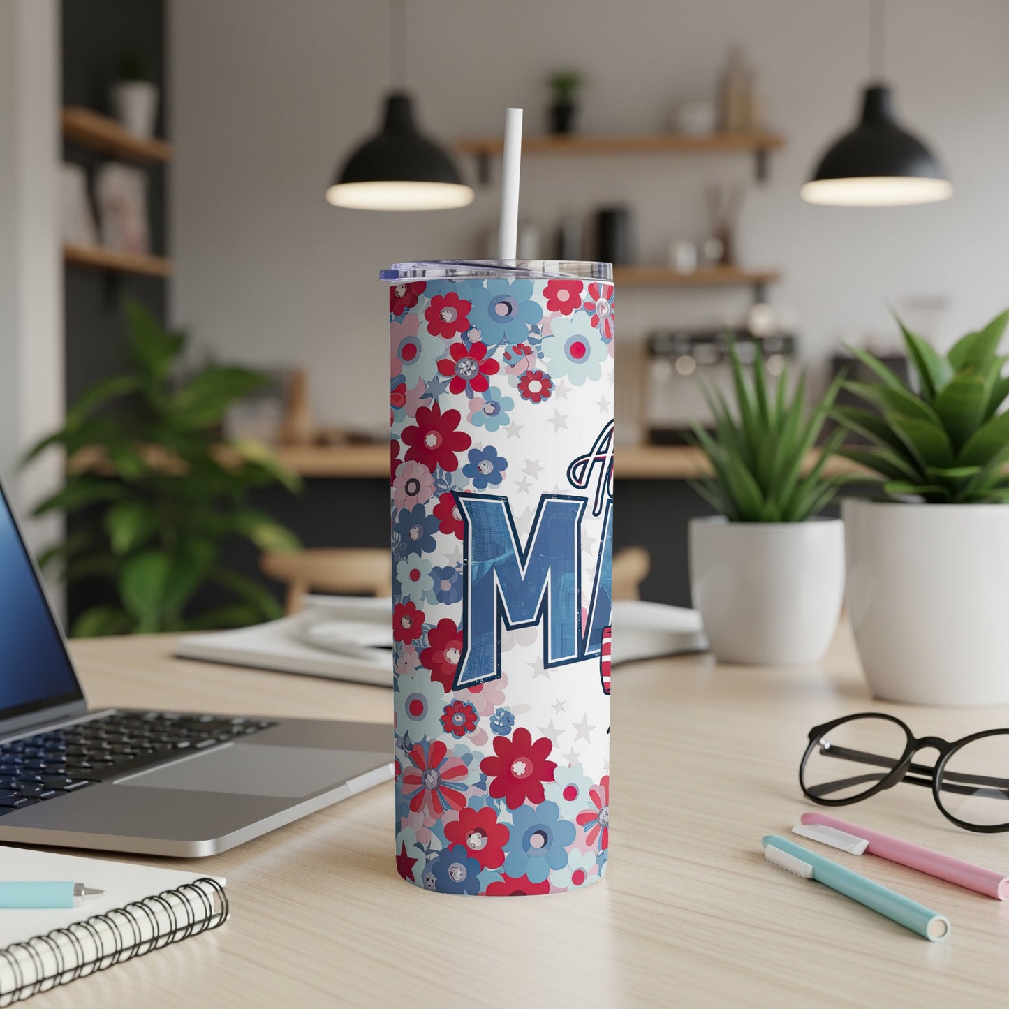 Floral tumbler with "Mama" text, a straw, and office desk background.