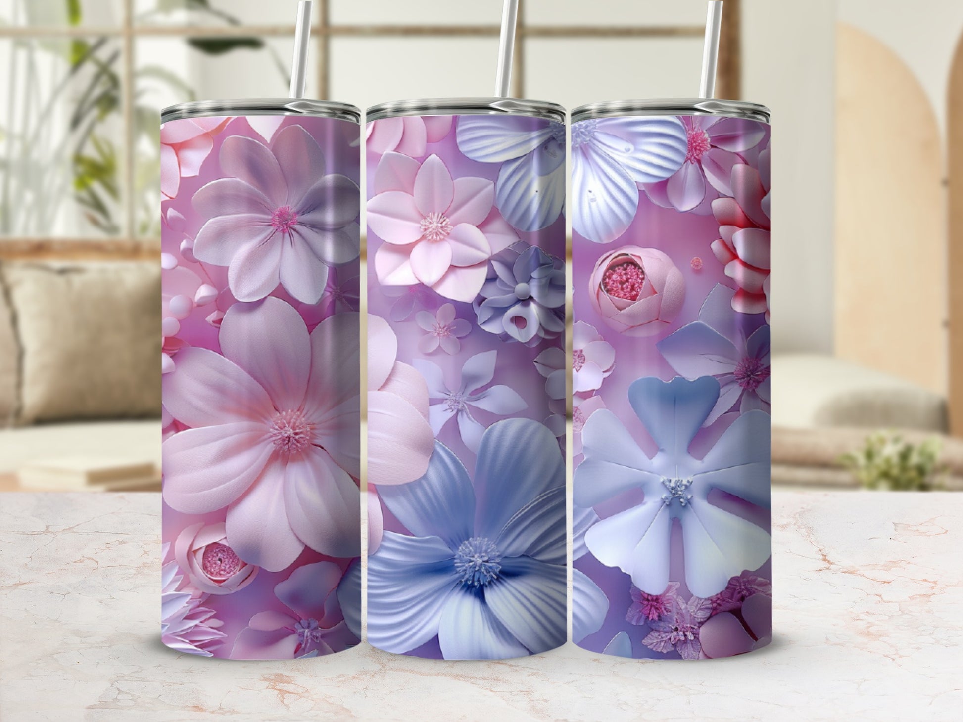 Three tumblers with pink and blue floral patterns.