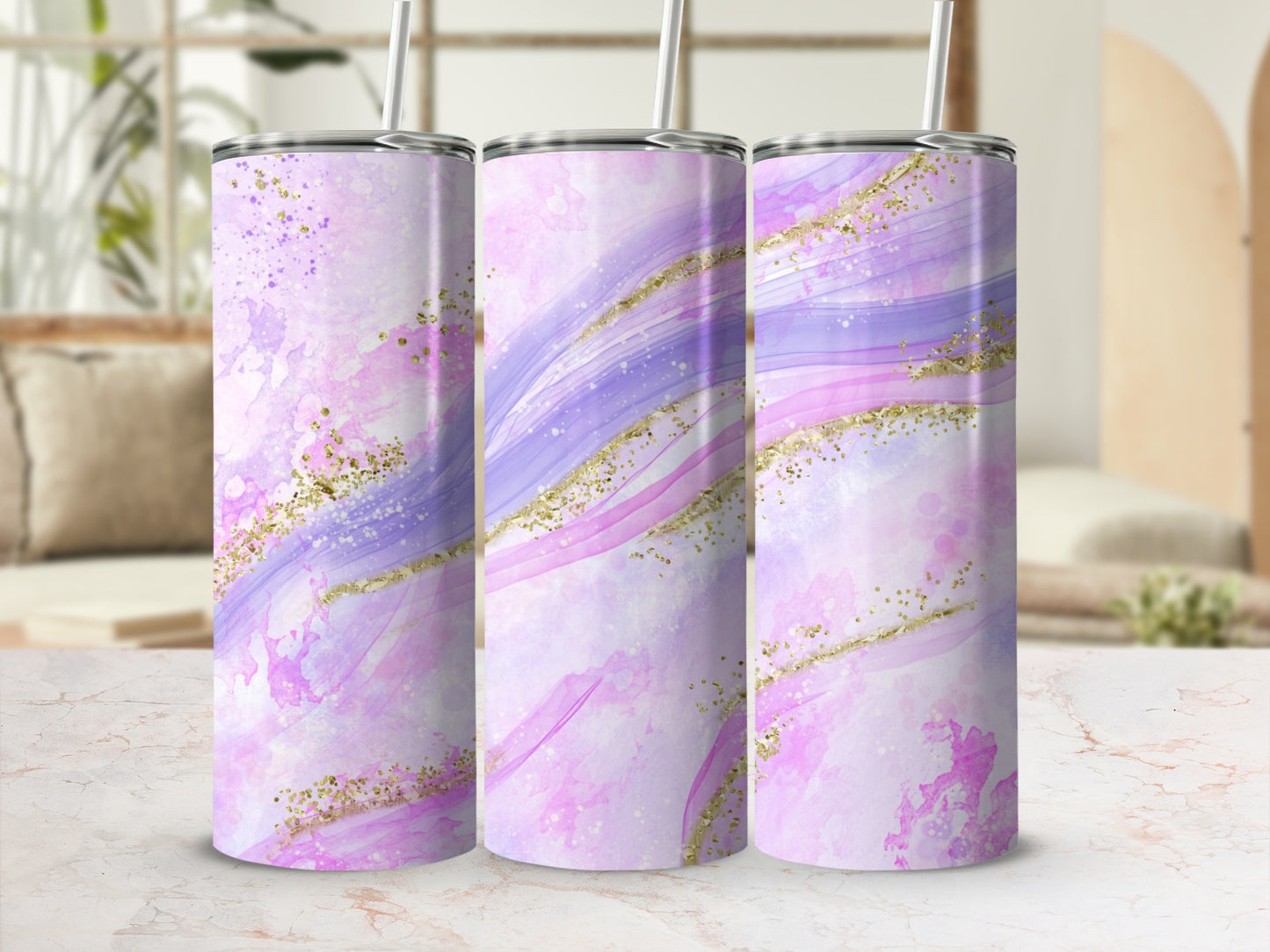 Three pink and purple abstract glitter tumblers with straws.