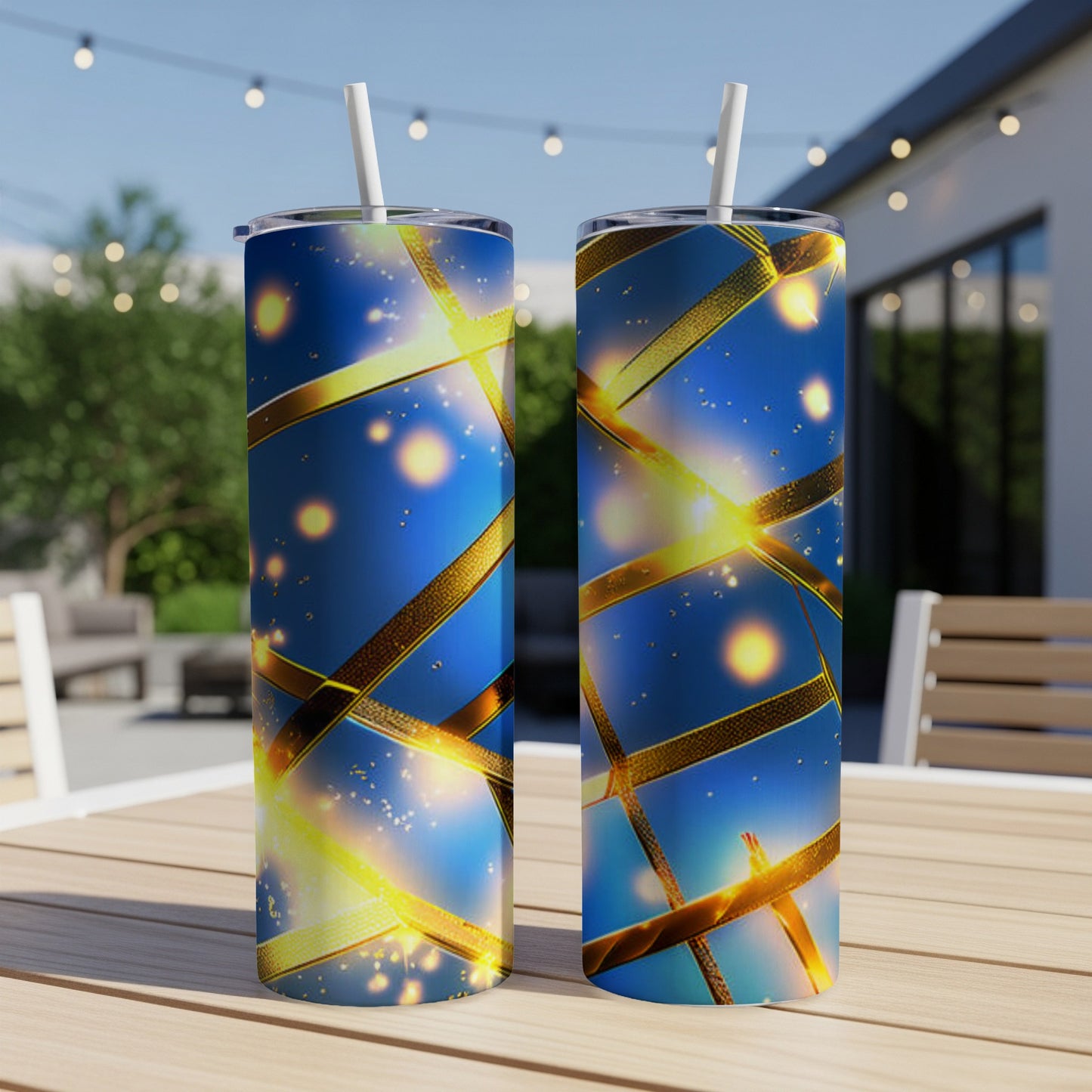Two blue tumblers with gold ribbon and light effect design.