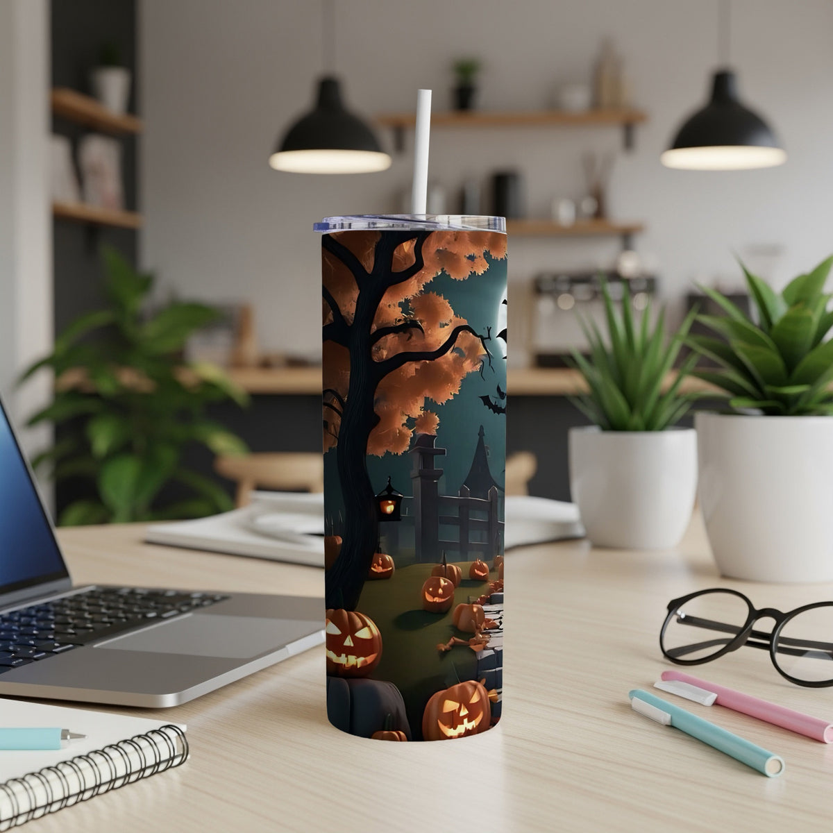 Tumbler with a Halloween scene featuring carved pumpkins, a spooky tree, and bats.