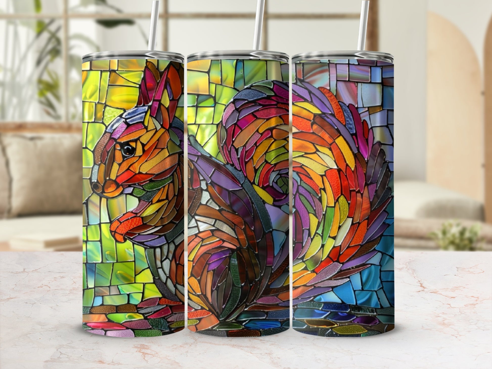 Stained glass squirrel design on three tumblers.