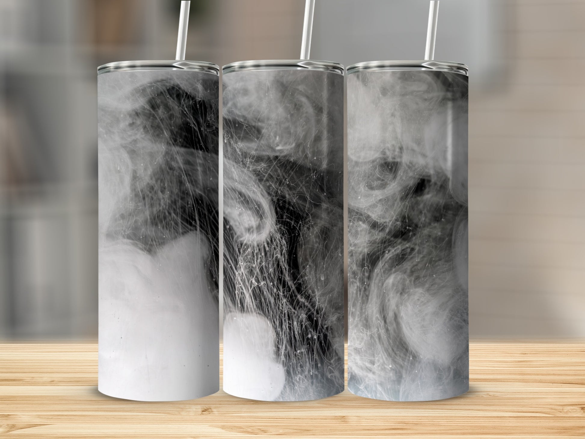 Three tumblers with a smoky, abstract black and white design.