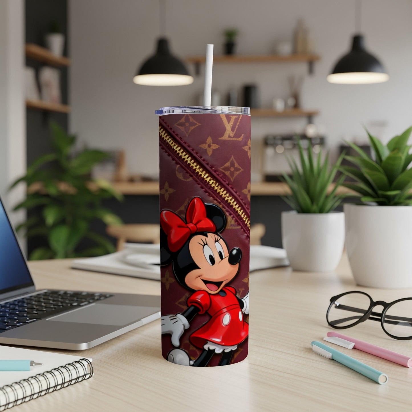 Minnie Mouse in a red dress on a maroon tumbler with a LV pattern.