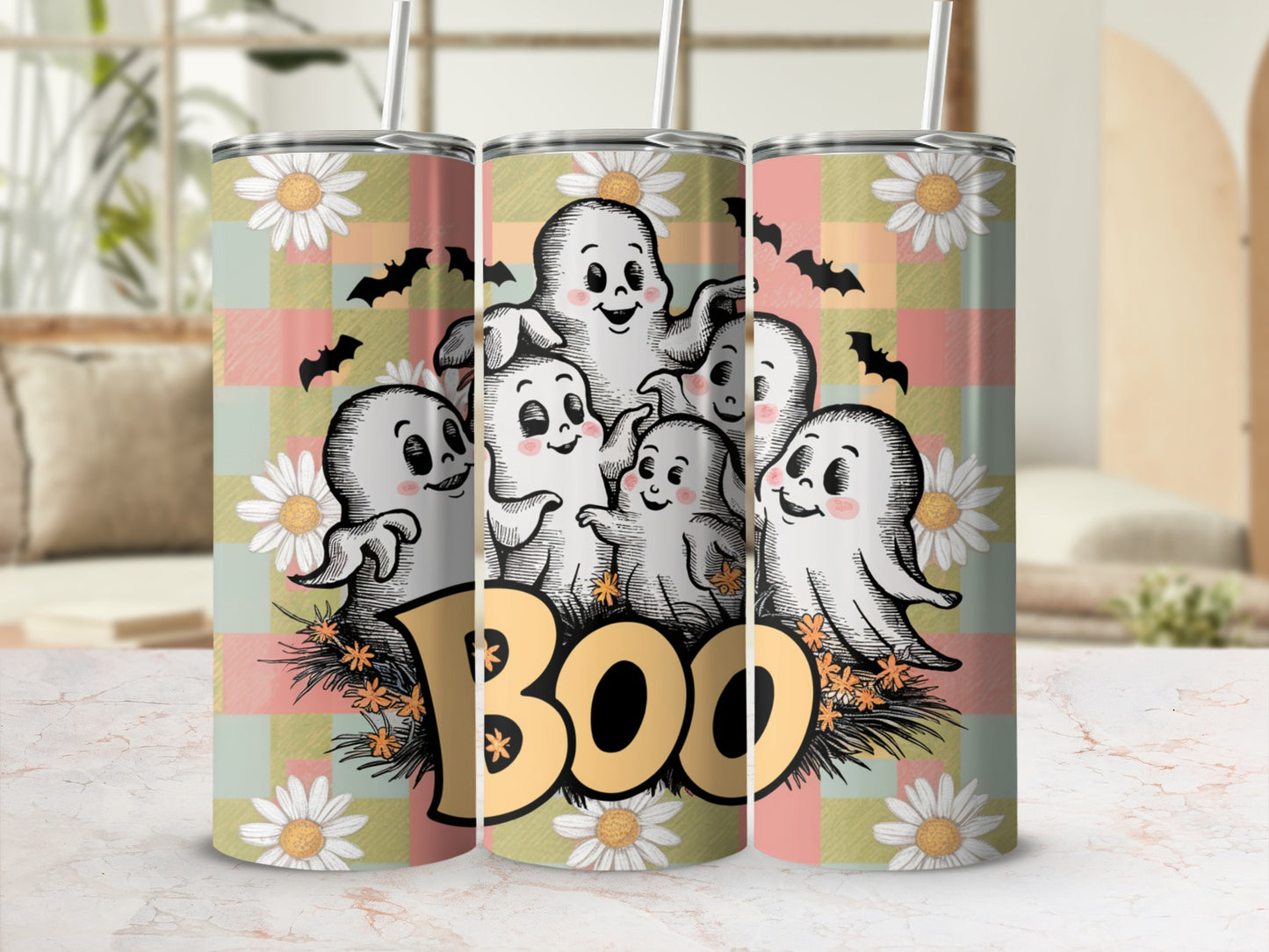 Halloween tumbler with ghosts, bats, daisies, and the word "BOO".
