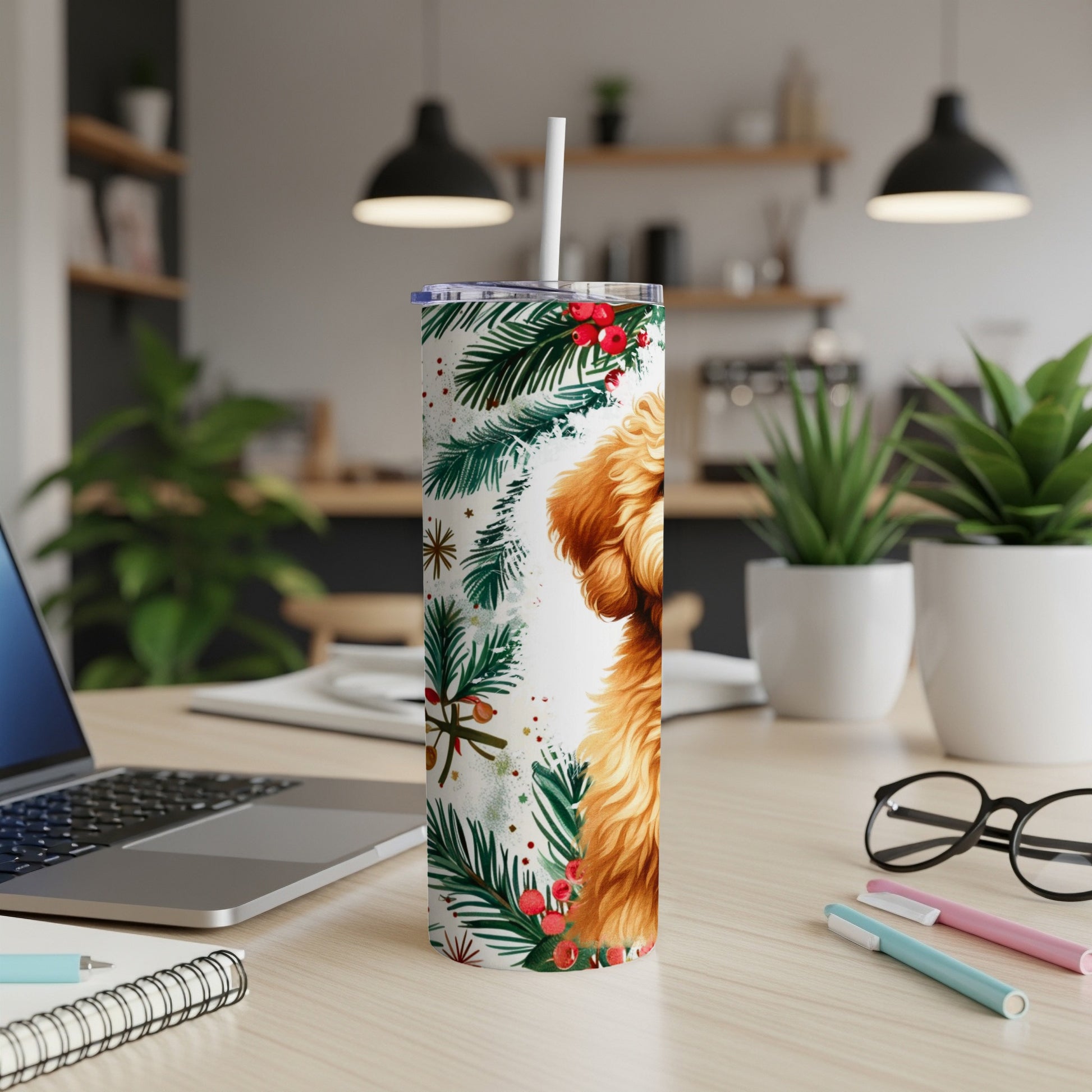 Goldendoodle dog with Christmas garland and snowflakes on a white tumbler.