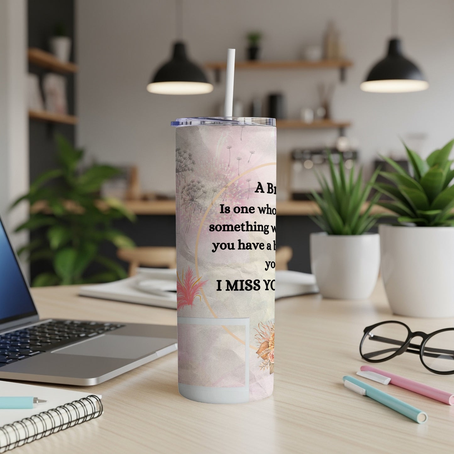 Tall tumbler with floral pattern and text "I MISS YO".