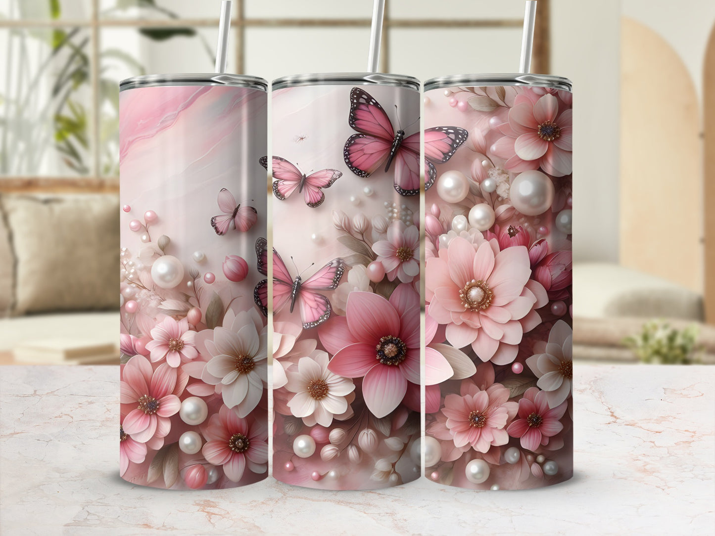 Pink floral and butterfly patterned tumblers with straws.