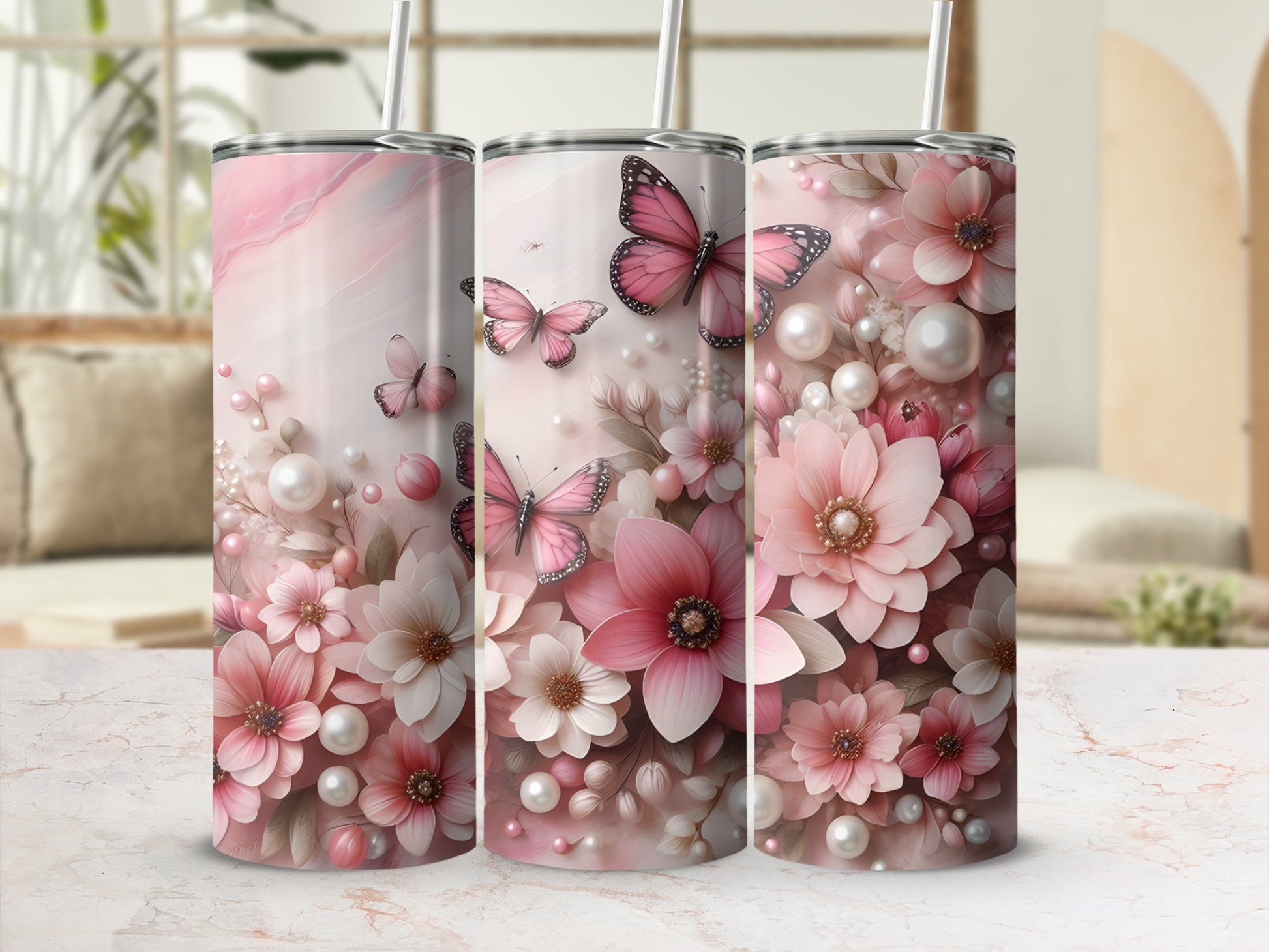 Pink floral and butterfly patterned tumblers with straws.