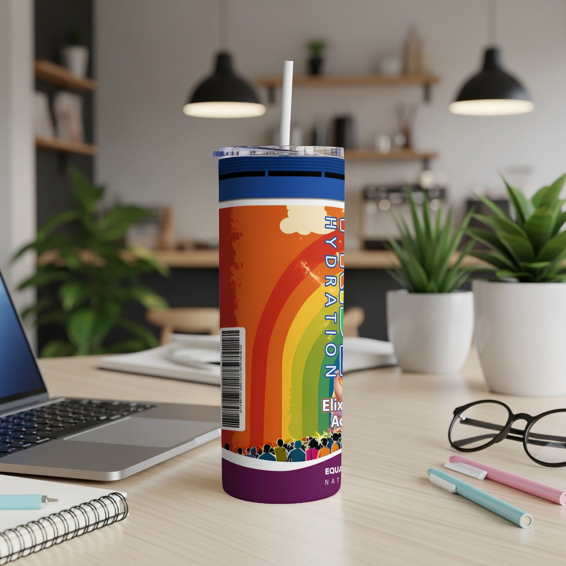 Rainbow-themed tumbler with "HYDRATION" and "EQUA" text, on a desk.