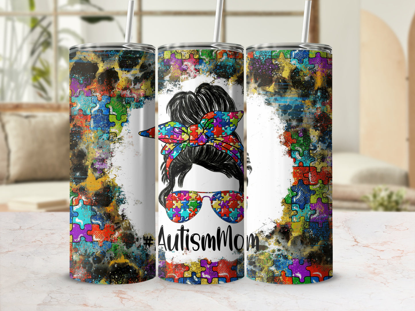 Autism Mom tumbler with colorful puzzle pieces and sunglasses.