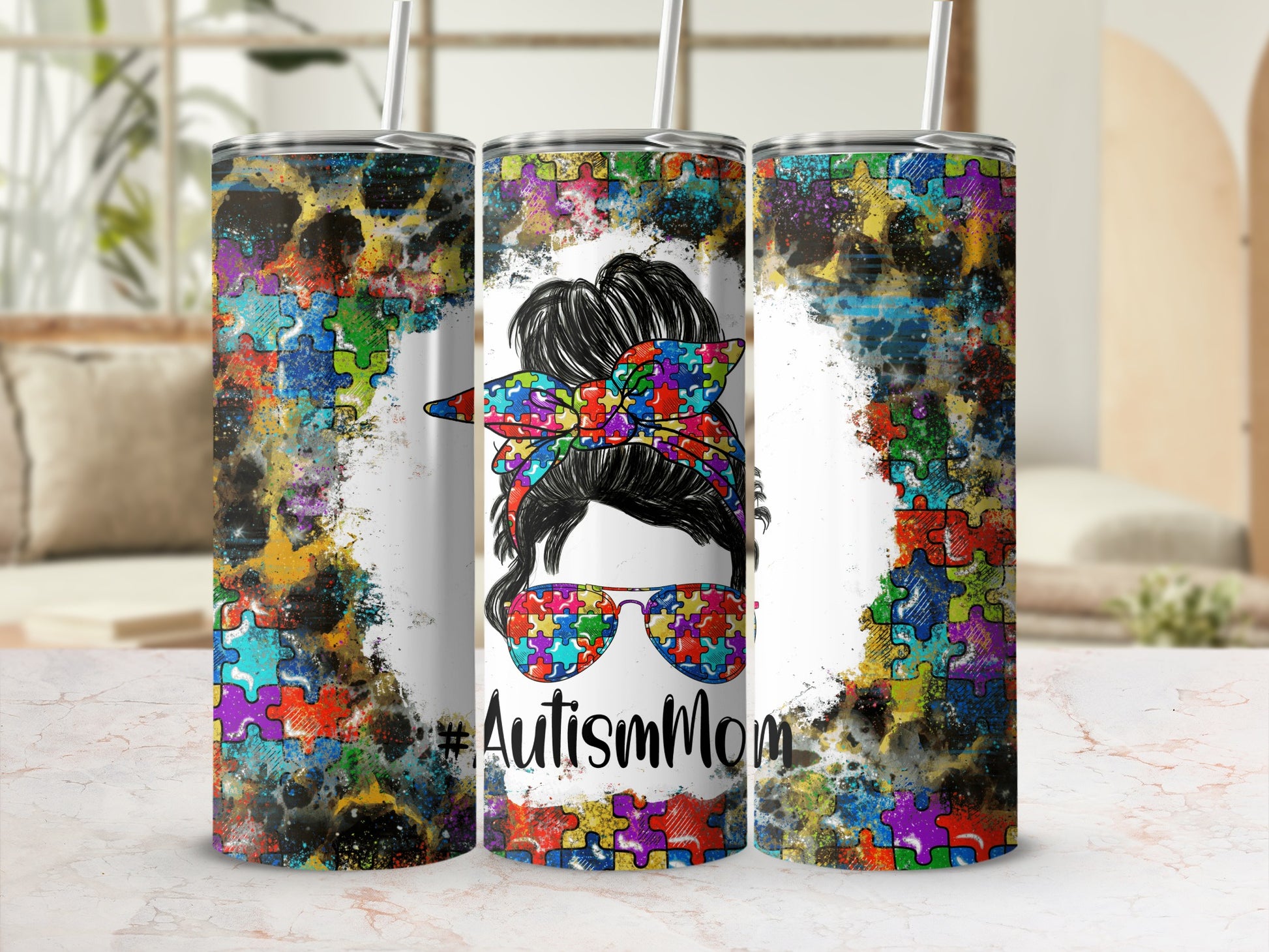 Autism Mom tumbler with colorful puzzle pieces and sunglasses.