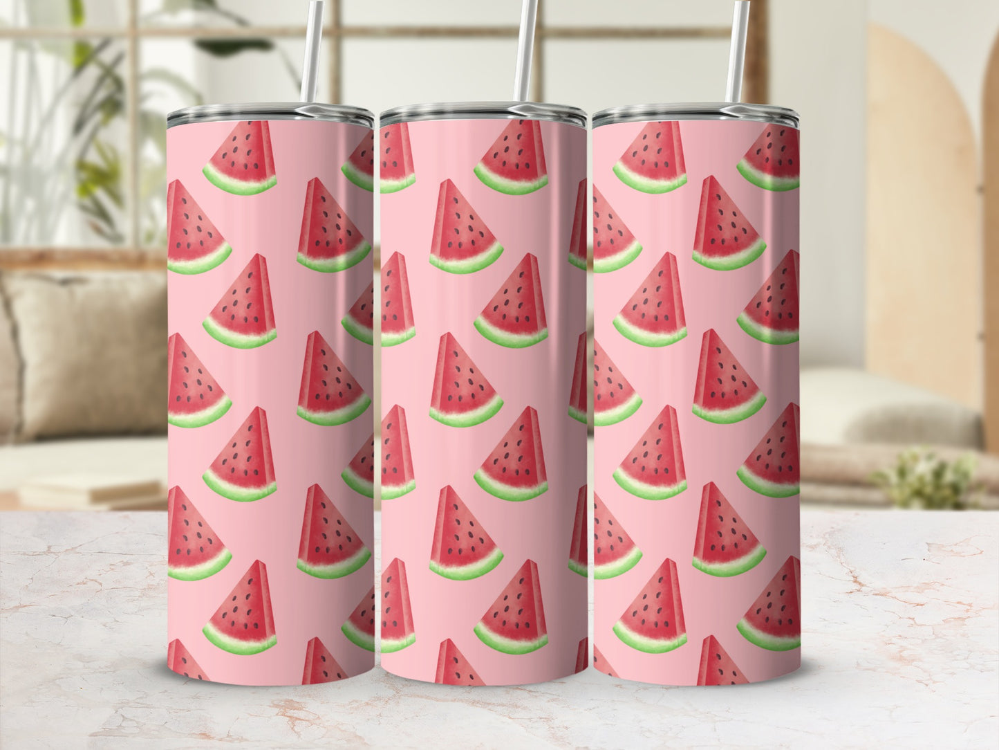 Three tumblers with a watermelon slice pattern and straw.