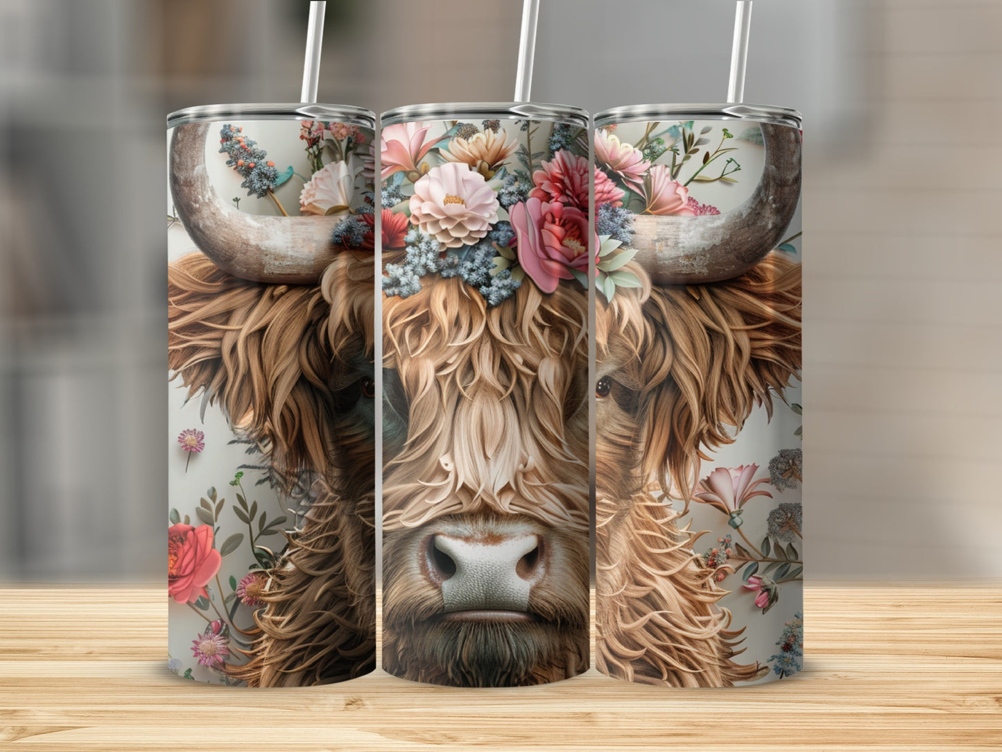 Highland cow with floral crown on three tumblers.