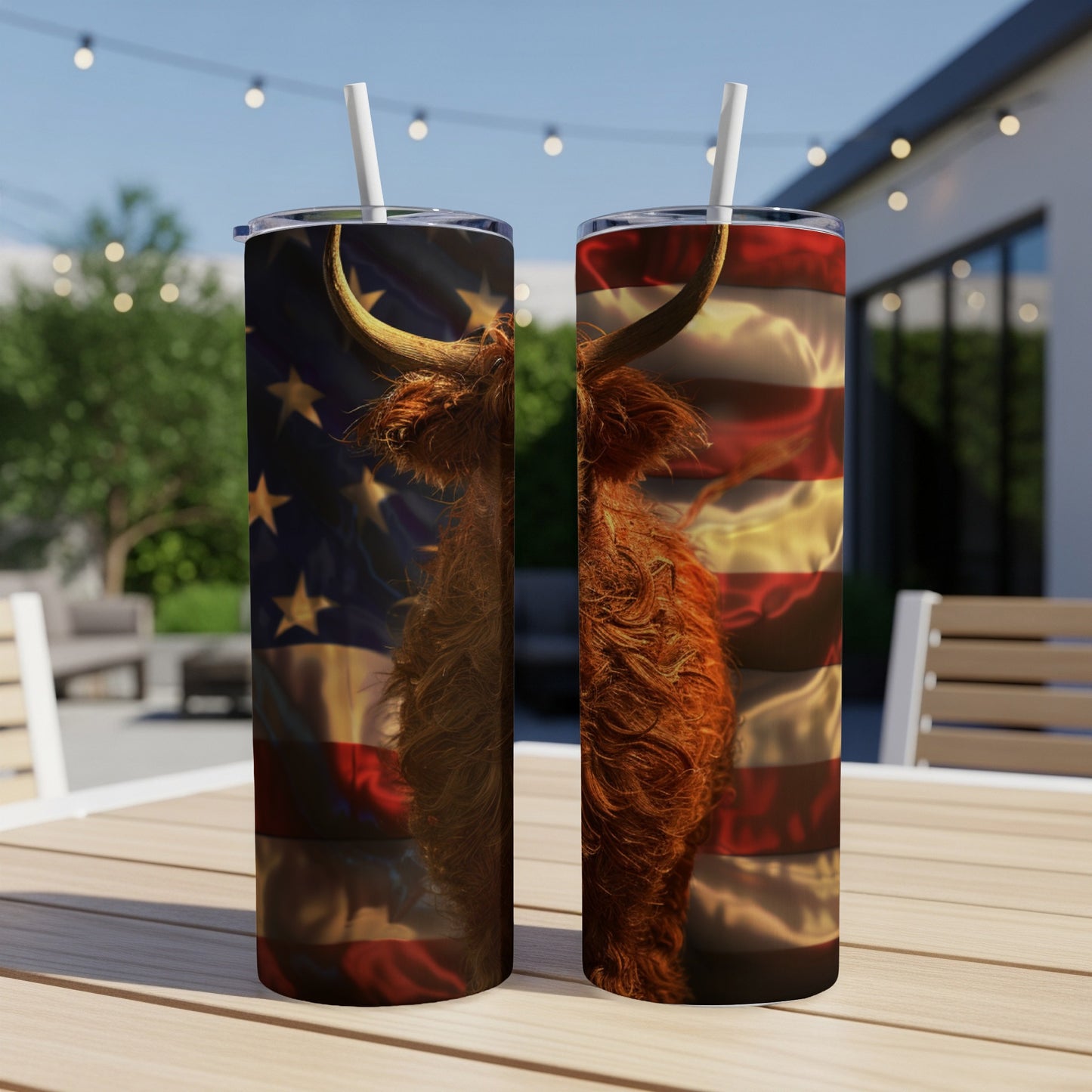 Highland cow with American flag design on two tumblers on a table.