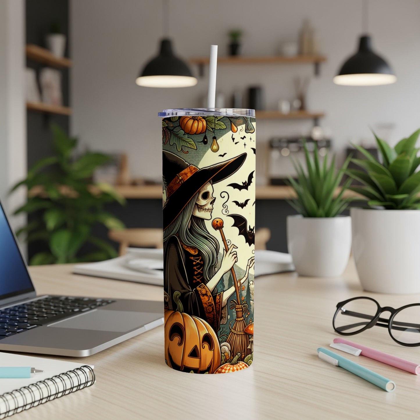Tall tumbler with skeleton witch, pumpkin, bats, and autumn leaves Halloween design.