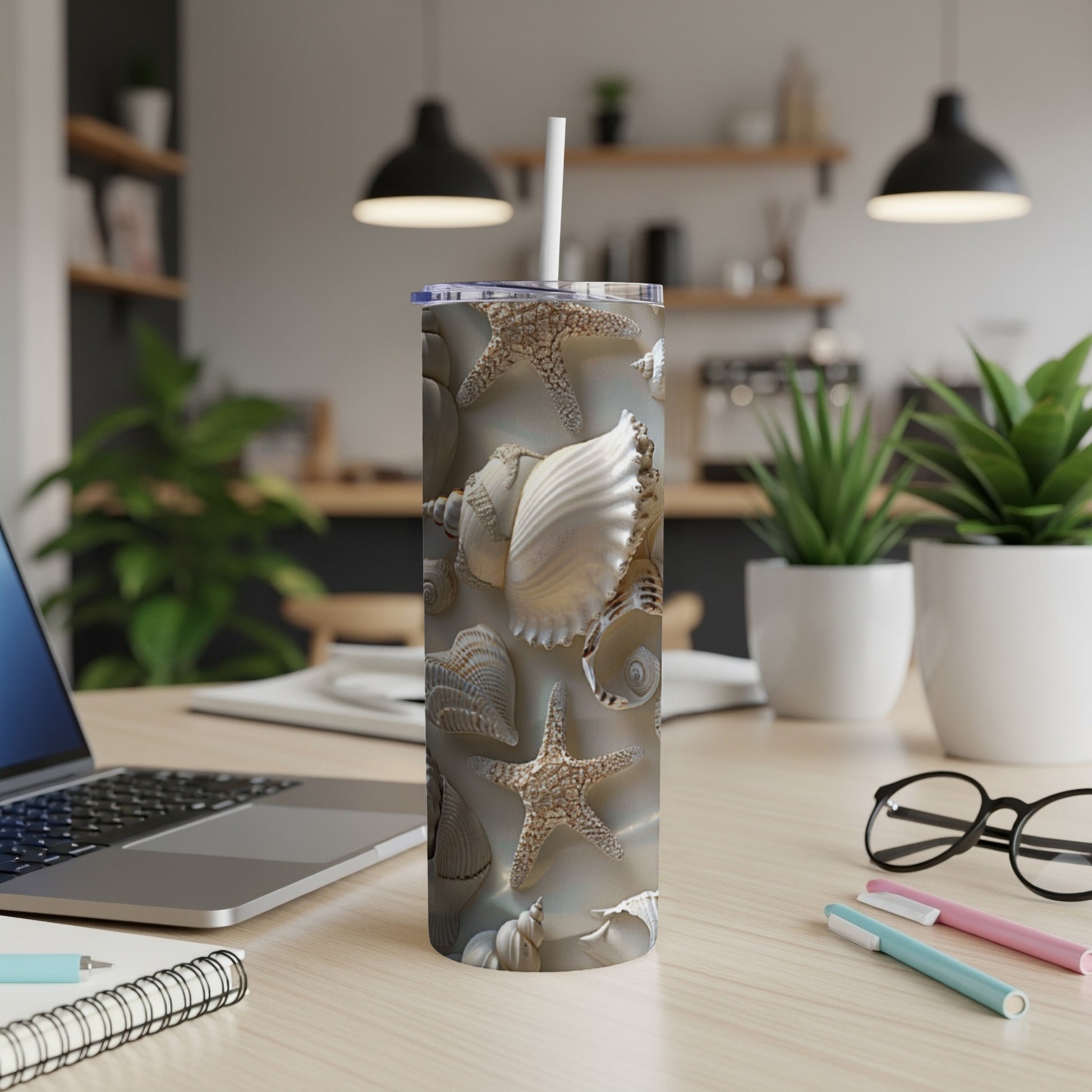 Seashell and starfish pattern on a white tumbler with a straw.