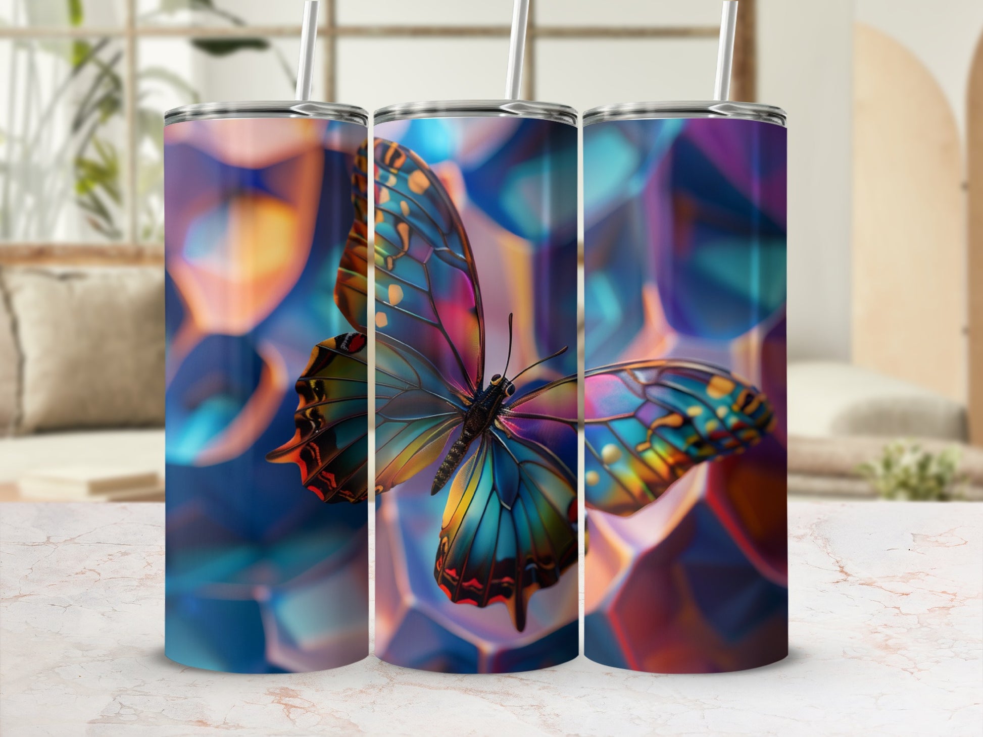 Three tumblers featuring a colorful butterfly against a blurred, geometric background.