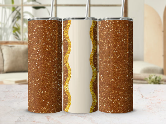 Gold glitter tumbler with wavy cream and gold design.