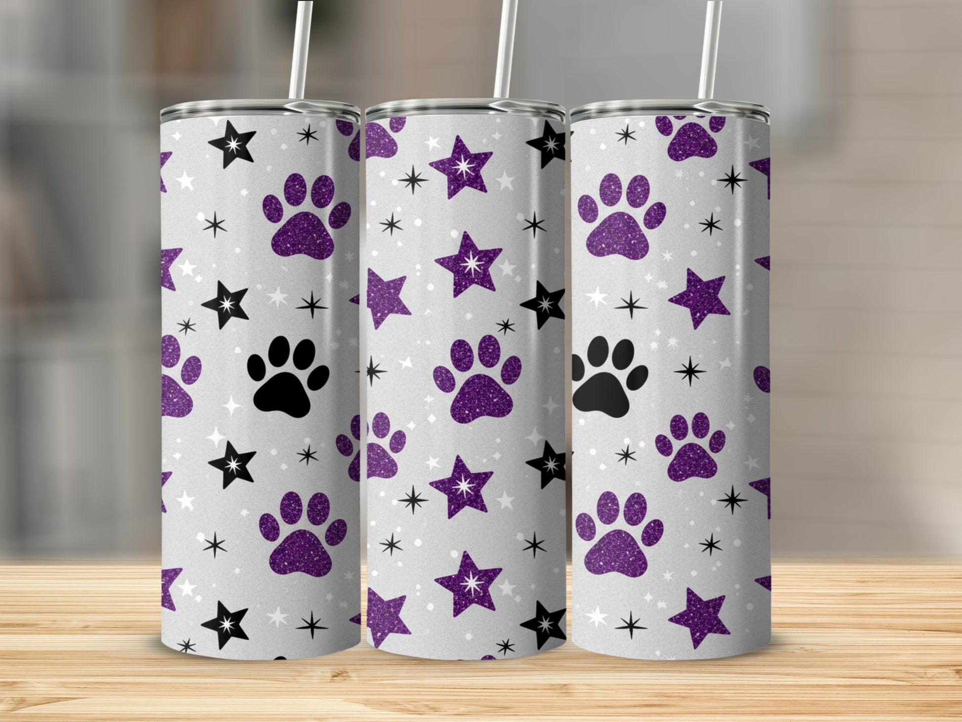Three tumblers with paw print and star glitter pattern.