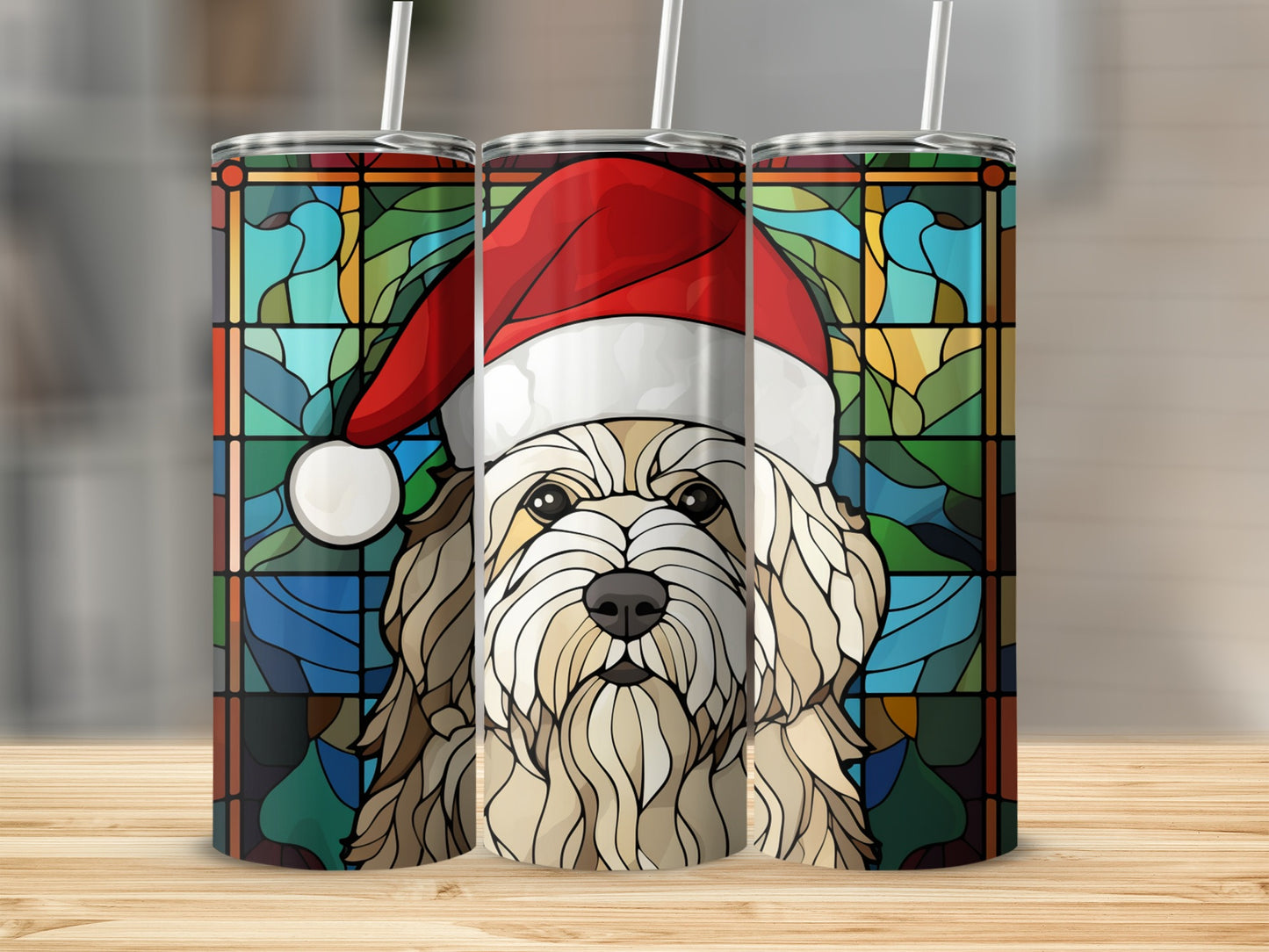 Dog wearing Santa hat with stained glass background on three tumblers.