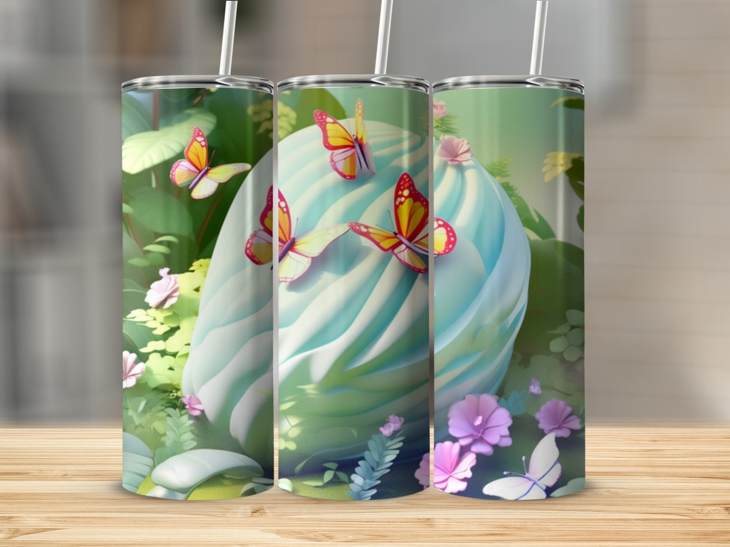 Three tumblers with a pastel swirl and butterflies design.