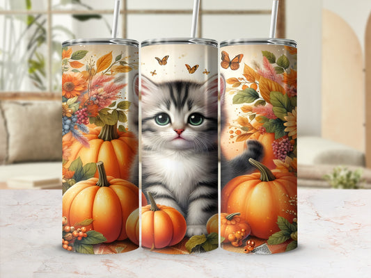 Kitten with pumpkins and butterflies, autumn floral border.