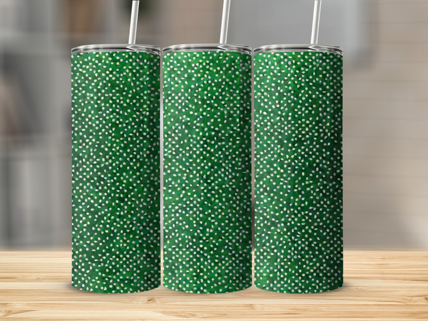 Three green tumblers with white speckled pattern and straws.