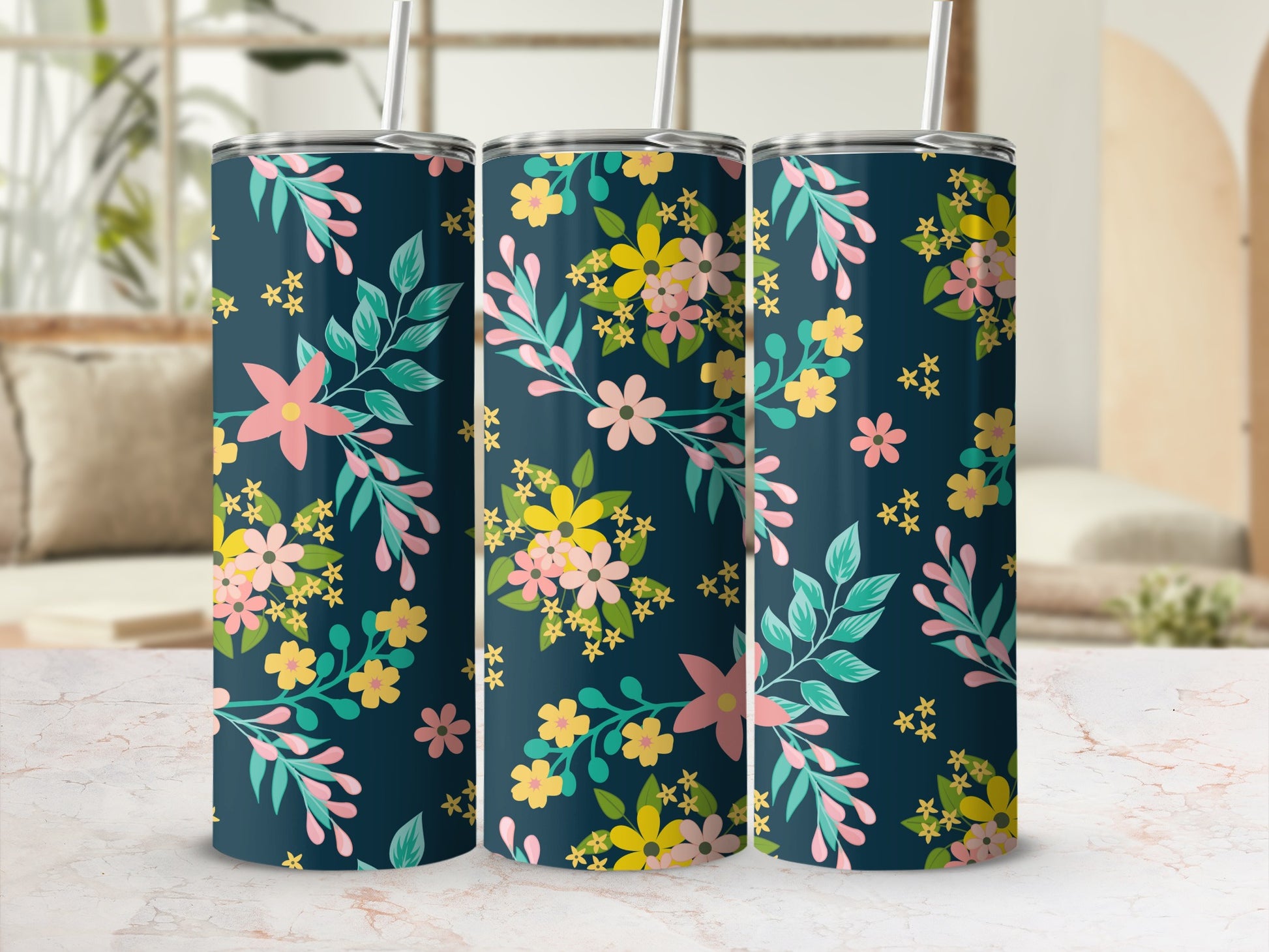 Three tumblers with a dark blue floral pattern featuring pink, yellow, and green flowers.