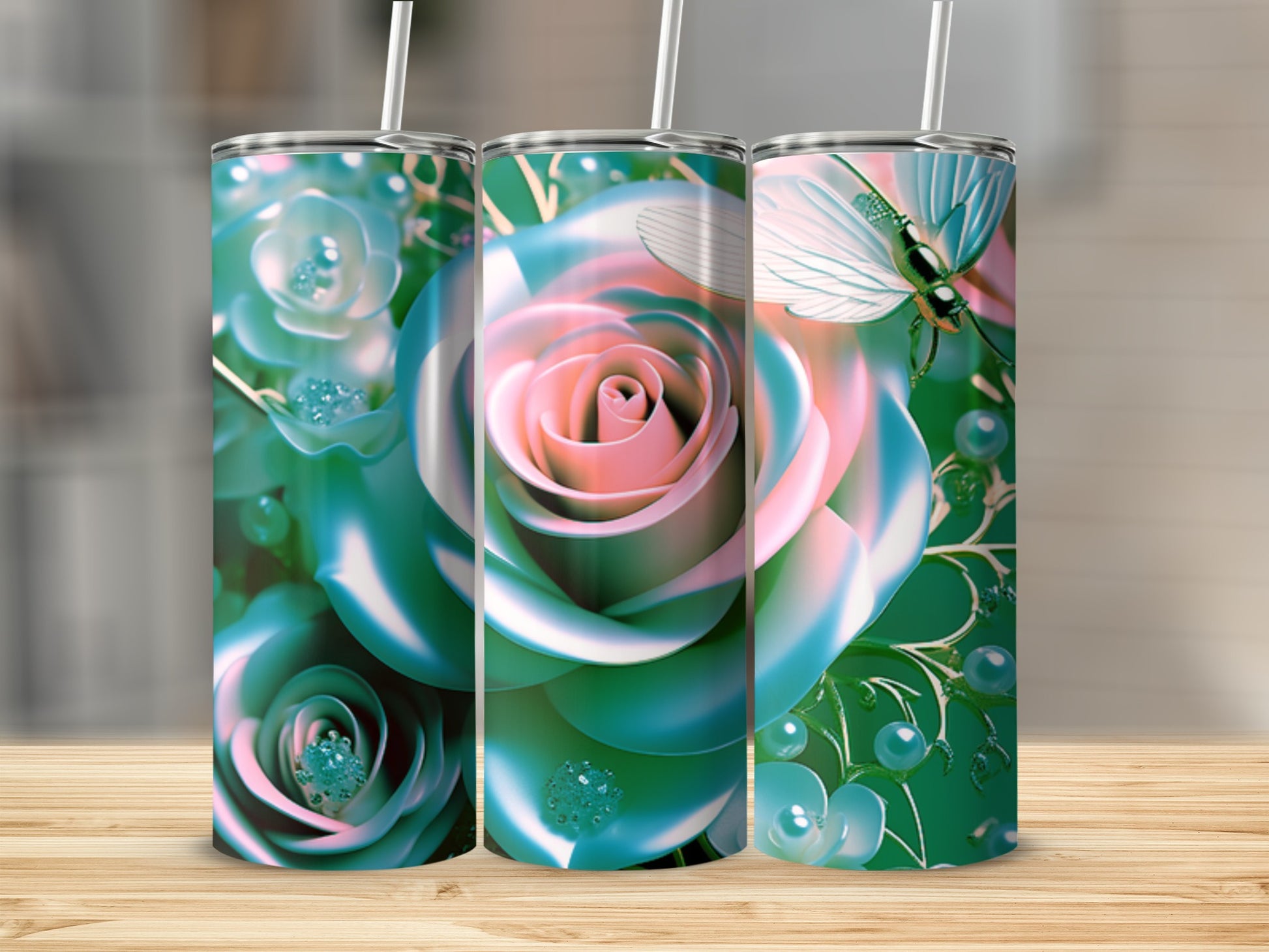 Three tumblers featuring teal and pink roses with pearl and butterfly accents.