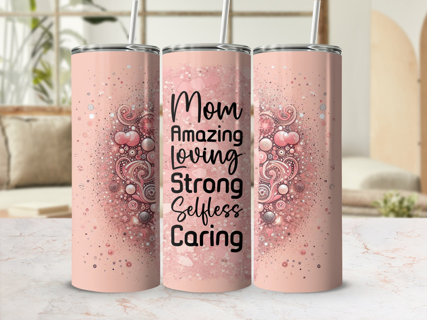 Pink tumbler with "Mom Amazing Loving Strong Selfless Caring" text and glitter details.