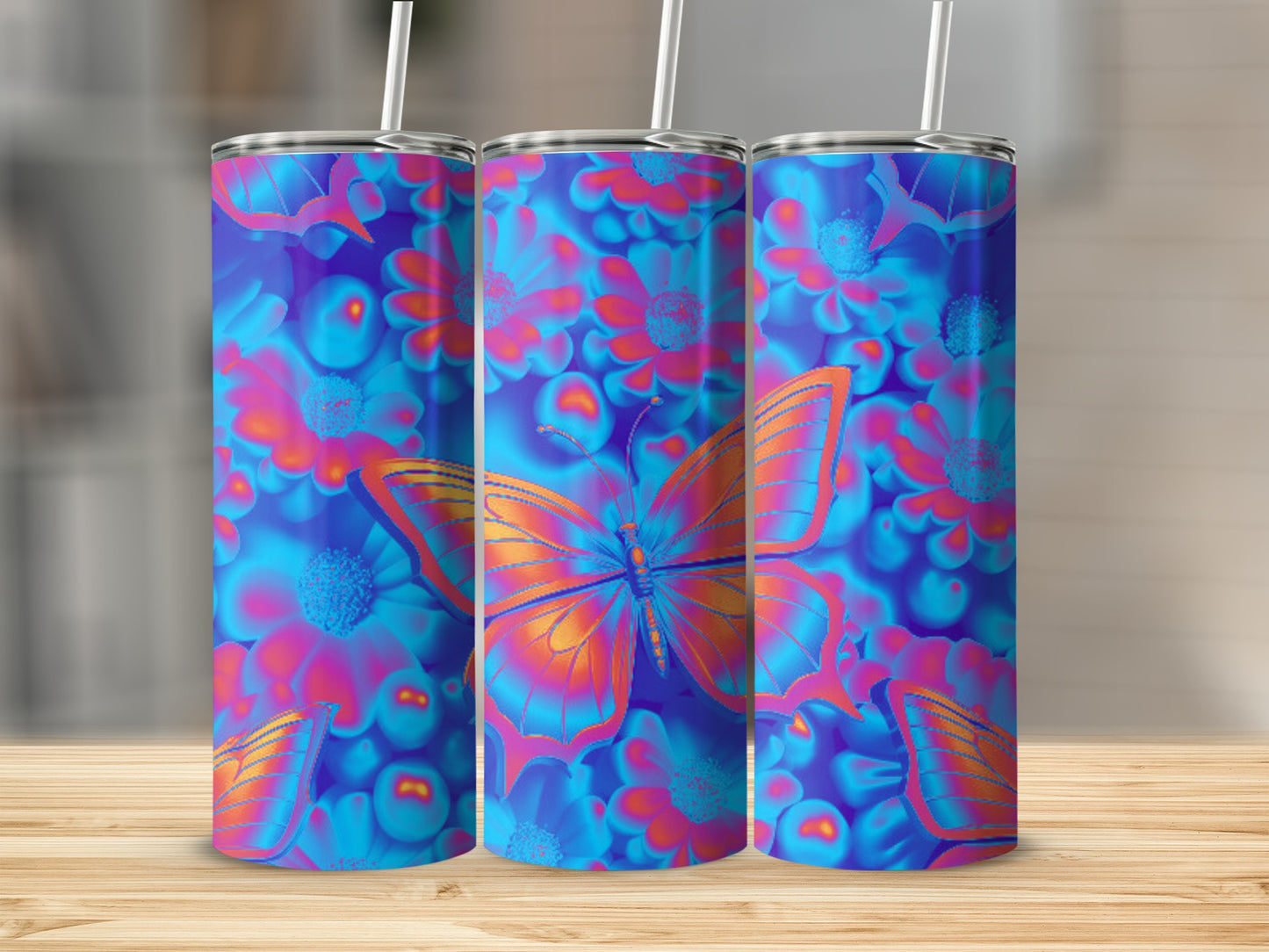 Three tumblers with a blue and purple butterfly and floral design.