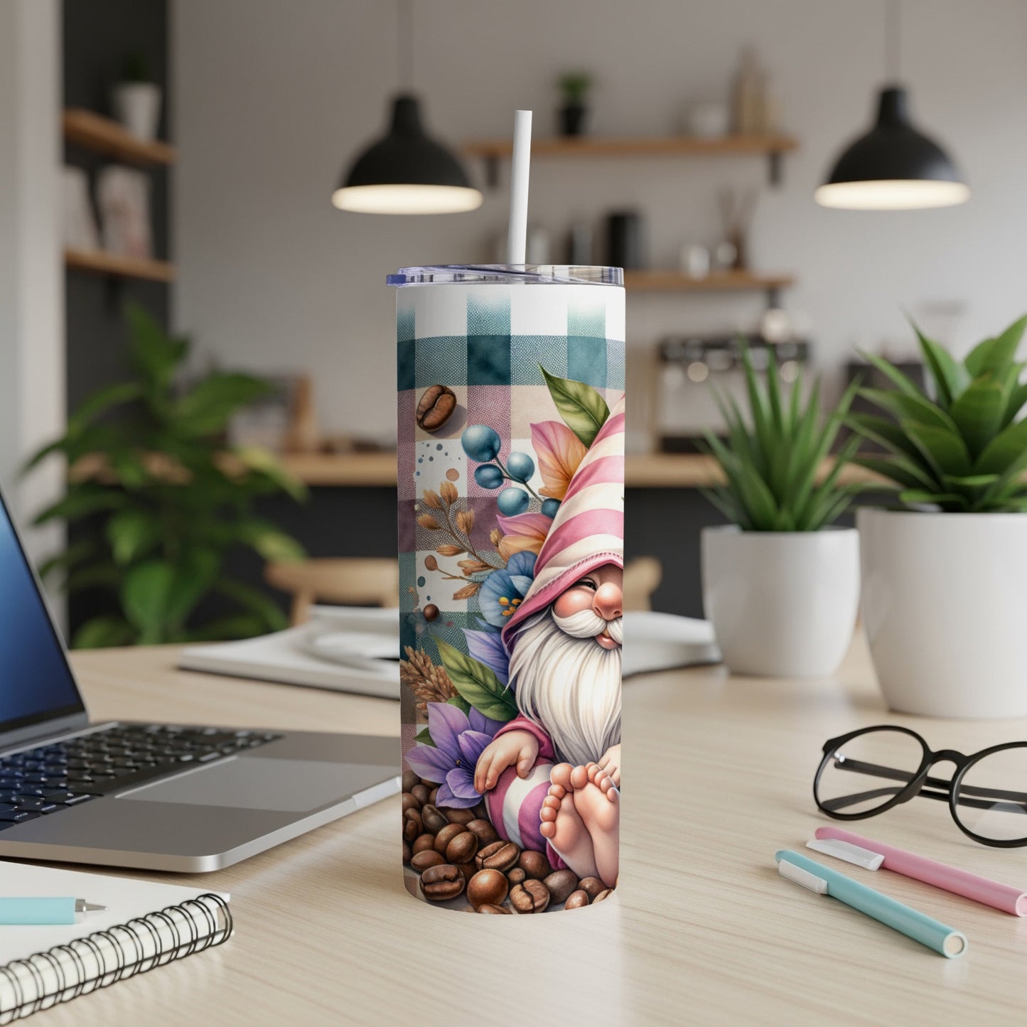 Tumbler with gnome, coffee beans, and floral pattern.