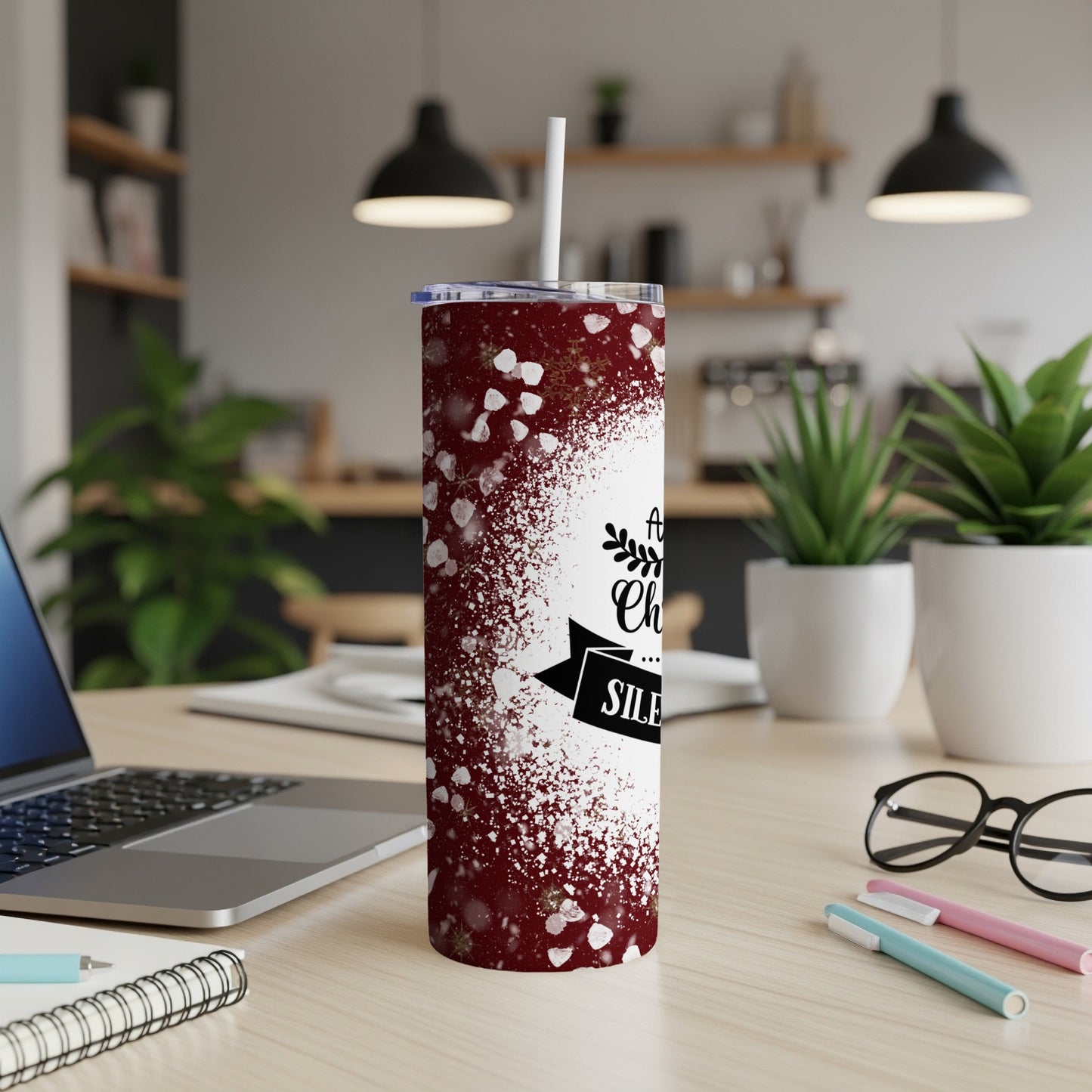 Maroon tumbler with white speckles and "All is calm, all is bright" text.