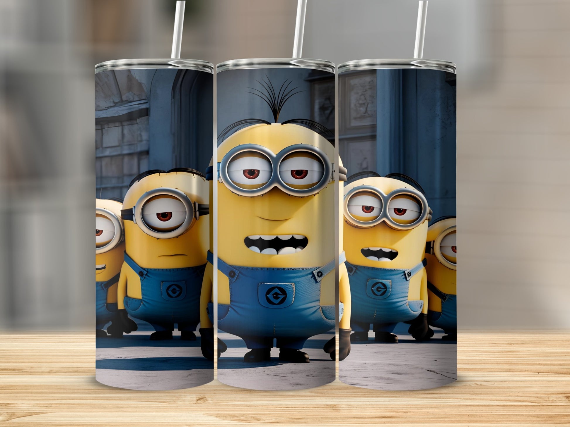 Three Minions in blue overalls and goggles with straws in their heads.