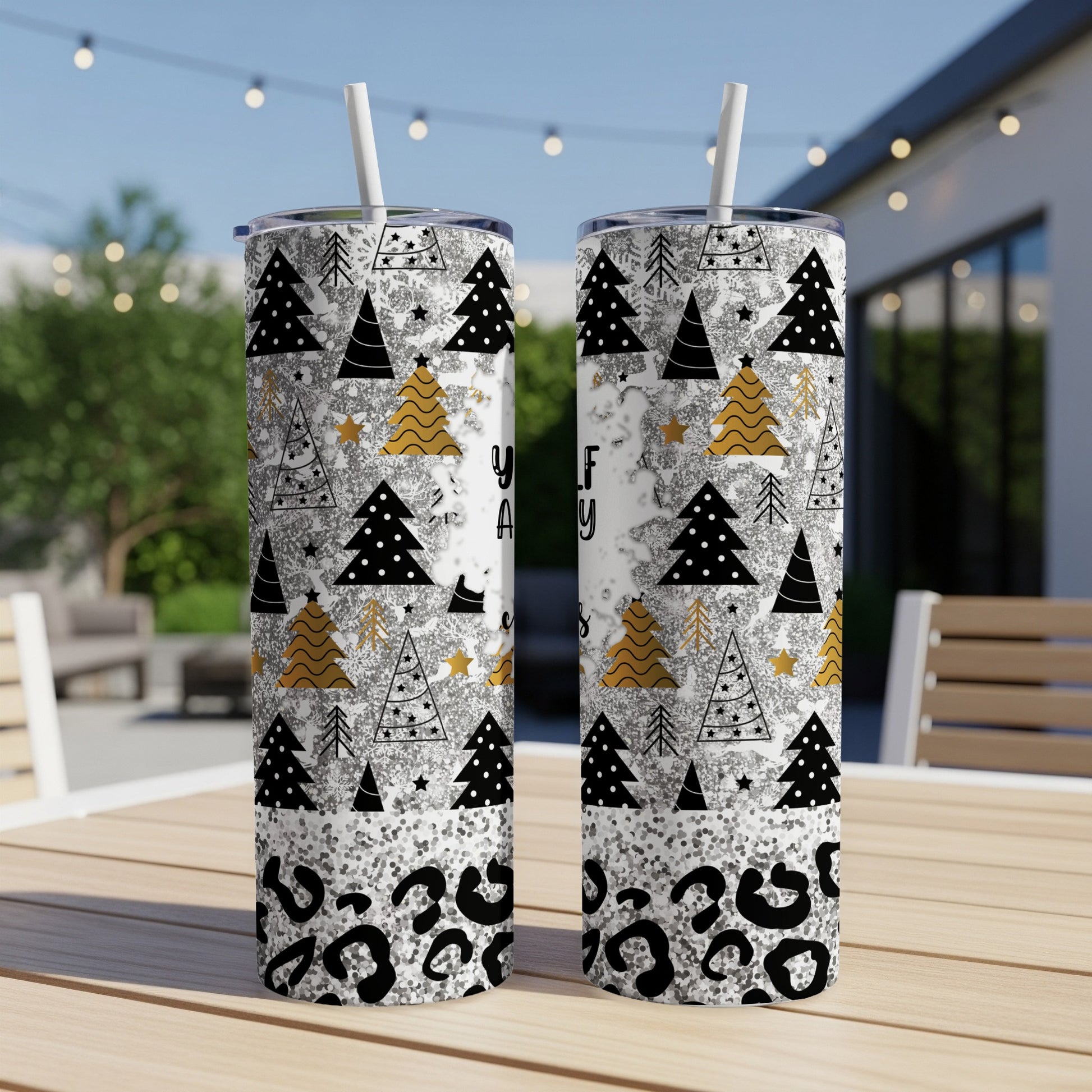 Two tall tumblers with Christmas trees and leopard print designs.