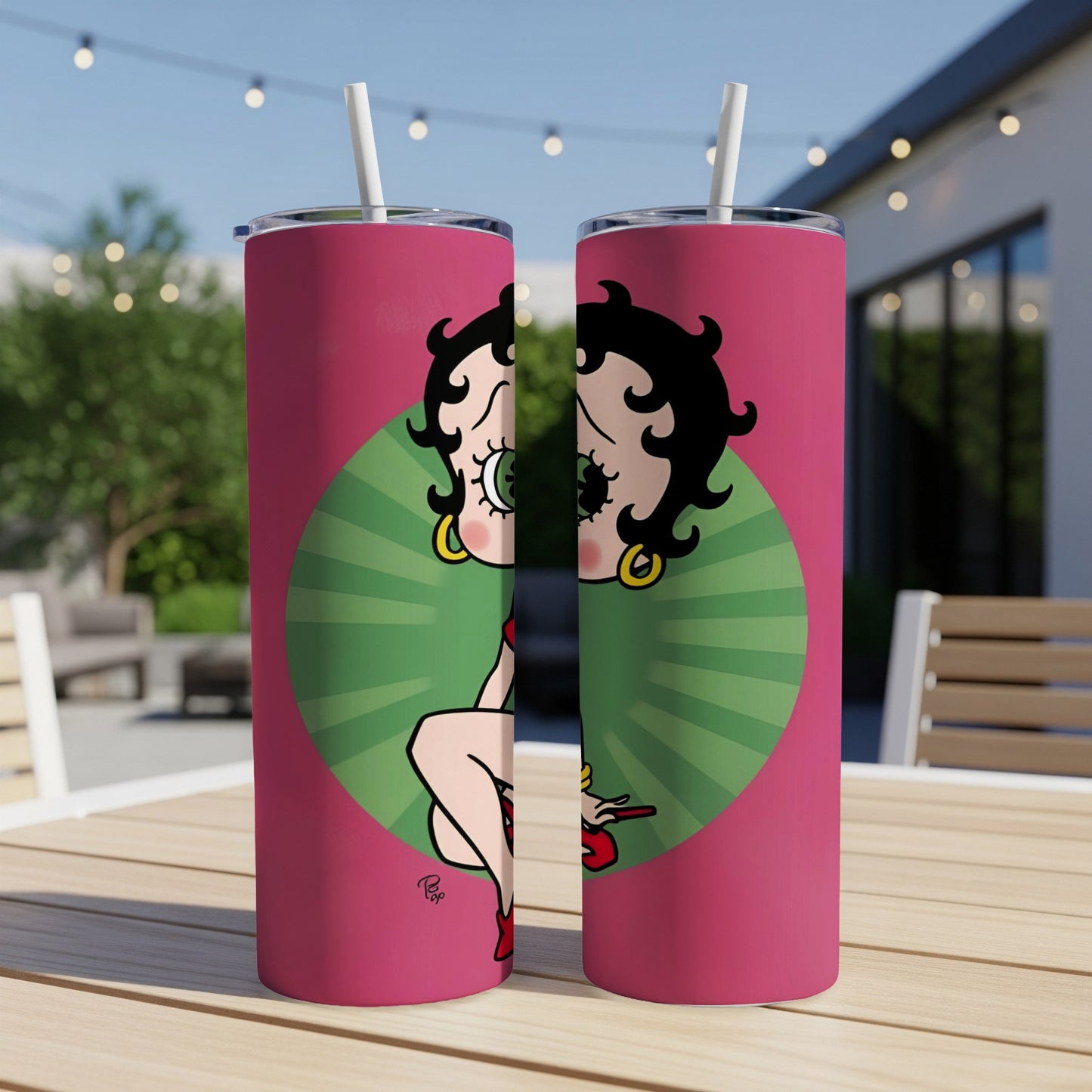 Betty Boop illustration on a pink tumbler with straw.