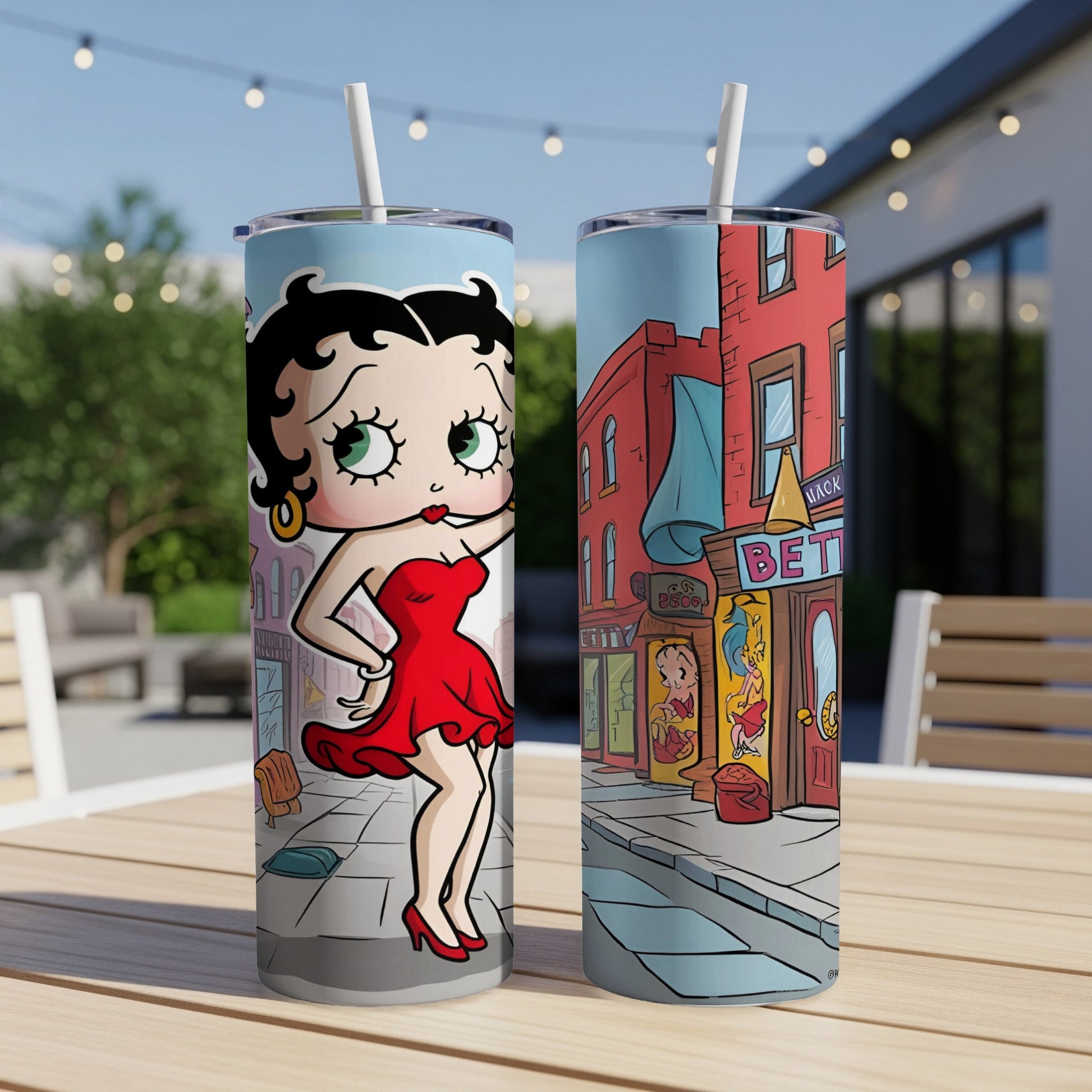 Betty Boop illustration on two tall tumblers with straws.