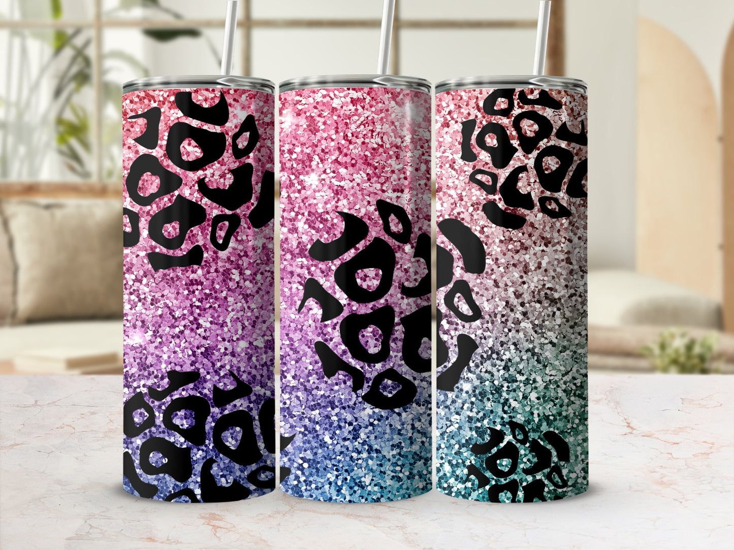 Three tumblers with a pink, purple, and blue glitter and leopard print design.