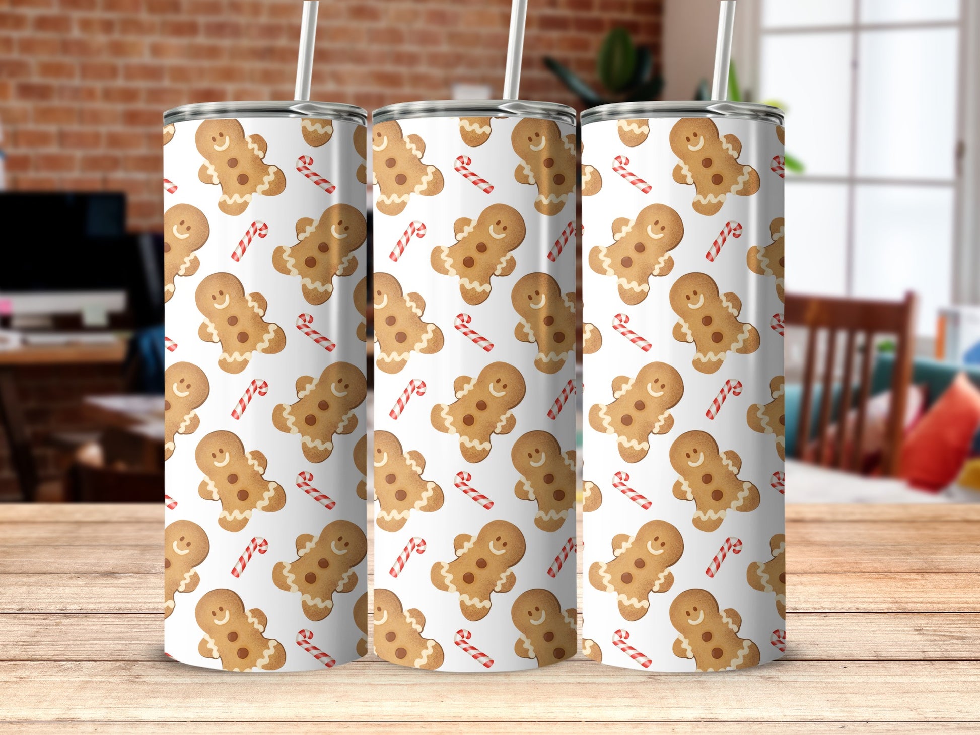 Three tumblers with gingerbread man and candy cane pattern.