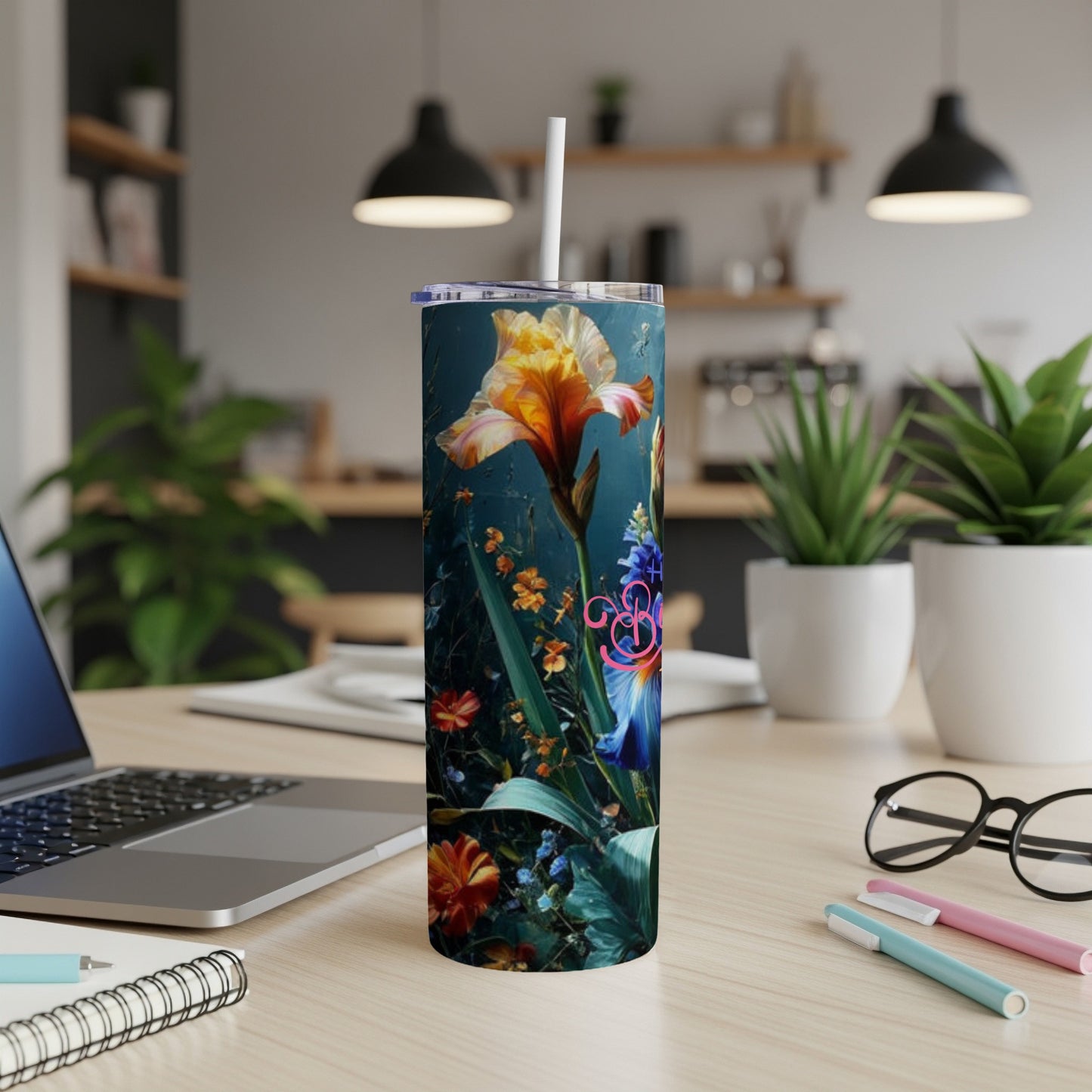 Tumbler with floral illustration of irises and other plants.