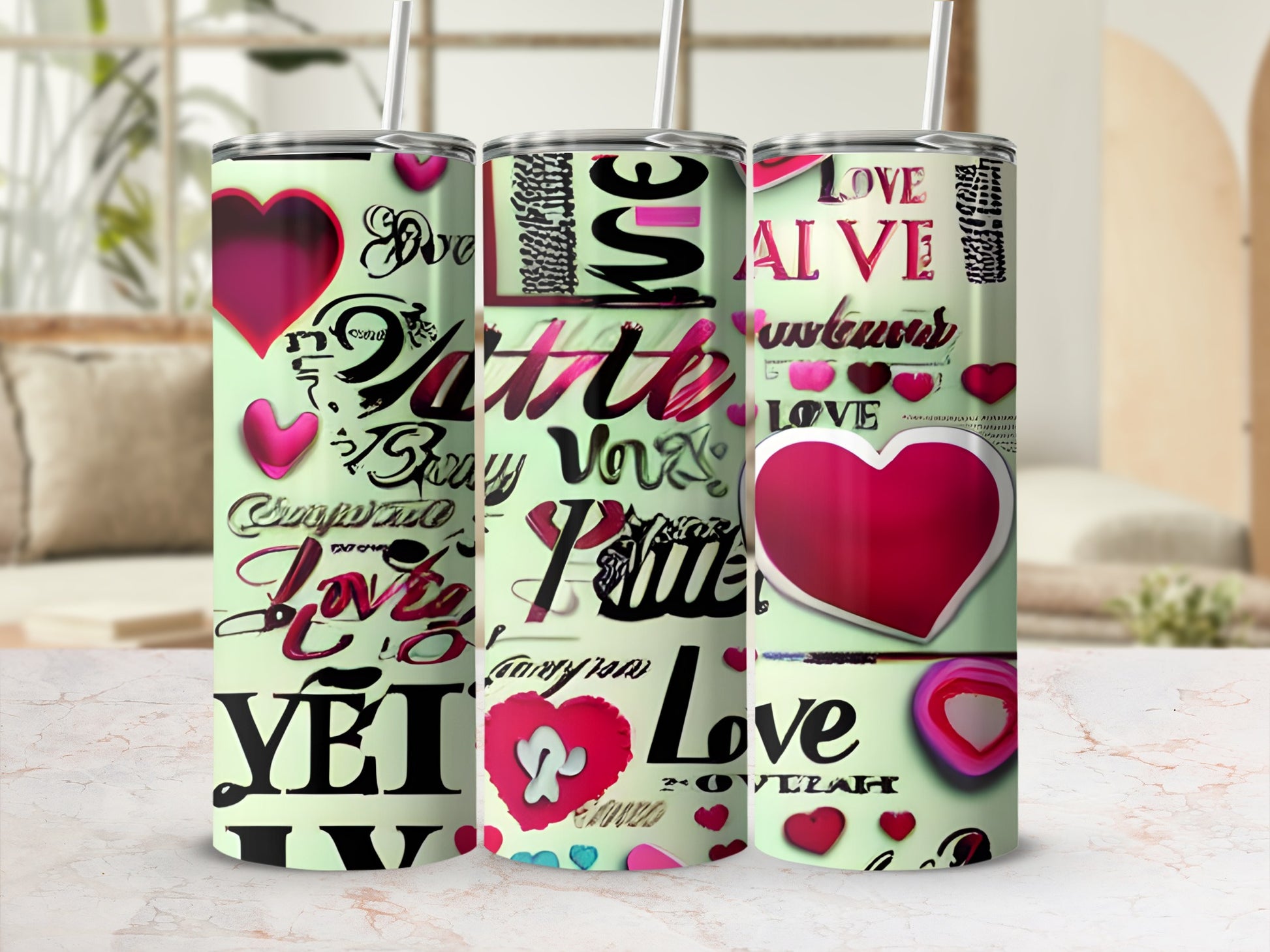 Three stainless steel tumblers with hearts and "Love" text.