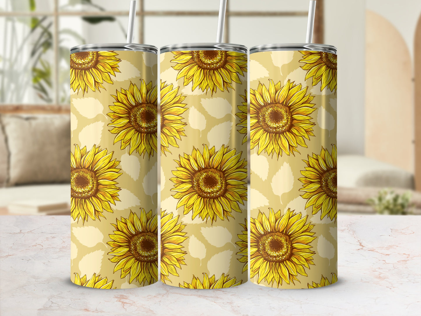 Three tumblers with a repeating sunflower pattern on a pale yellow background.