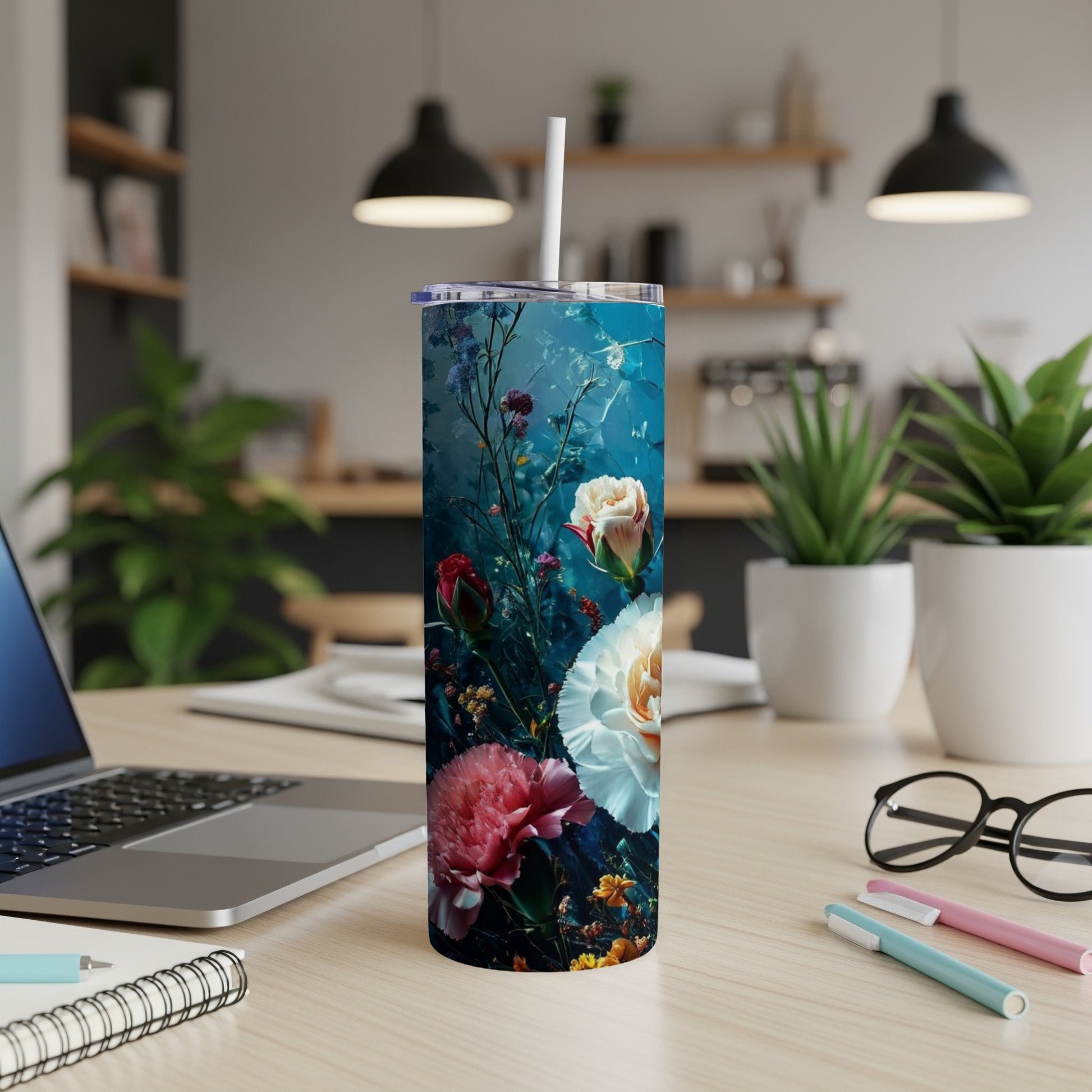 Tall tumbler with a floral design featuring pink and white roses on a dark blue background.